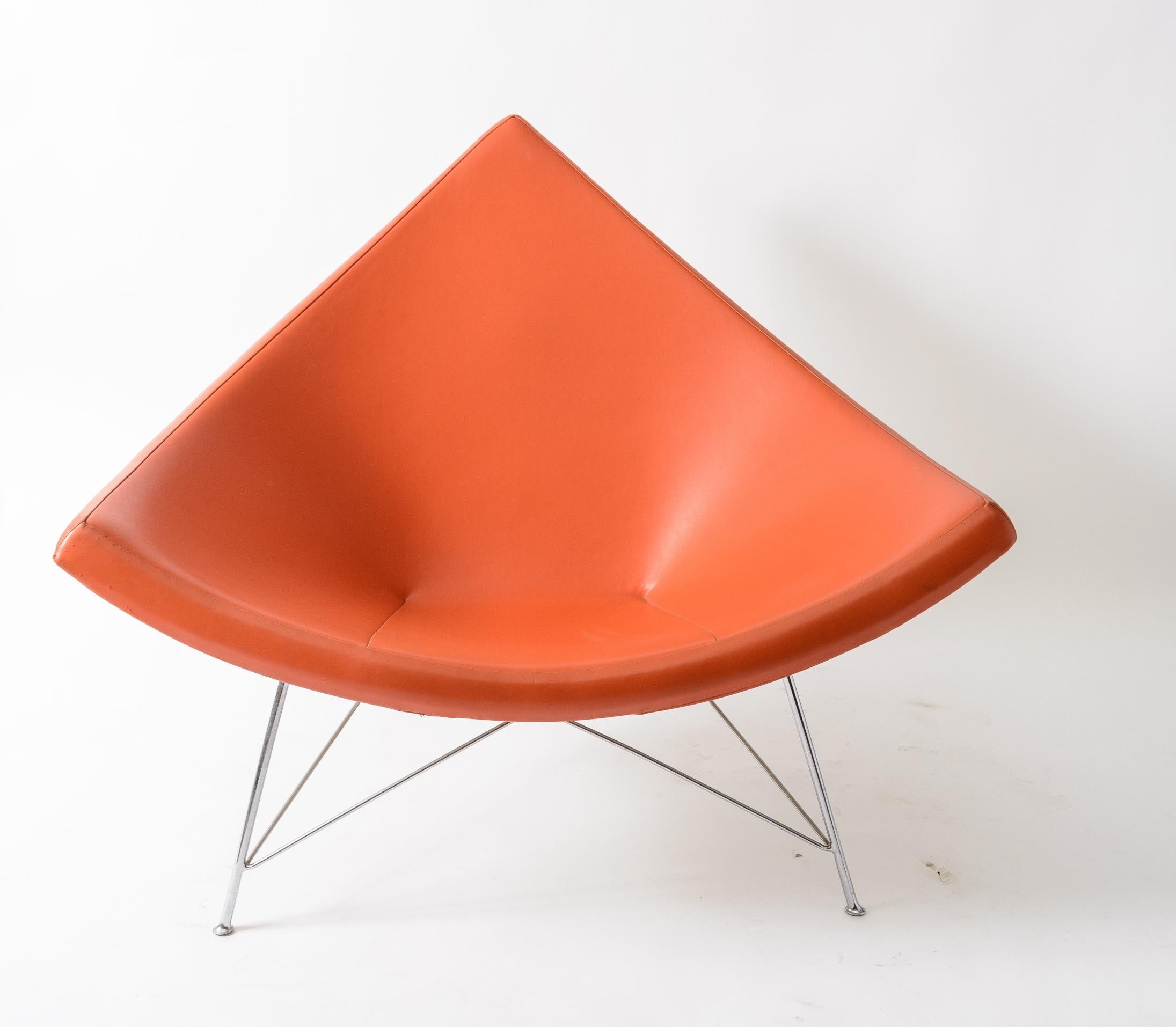 George Nelson Coconut Chair
1st series manufactured ,c. 1956
Original Orange Naugahyde Upholstery
Original White Enameled Shell
Foam is subtle
very small pinprick in seat and rubbing on edge (see photo's)