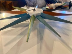 A. George Miller / Howard Miller Orologio a punte e stelle multicolori