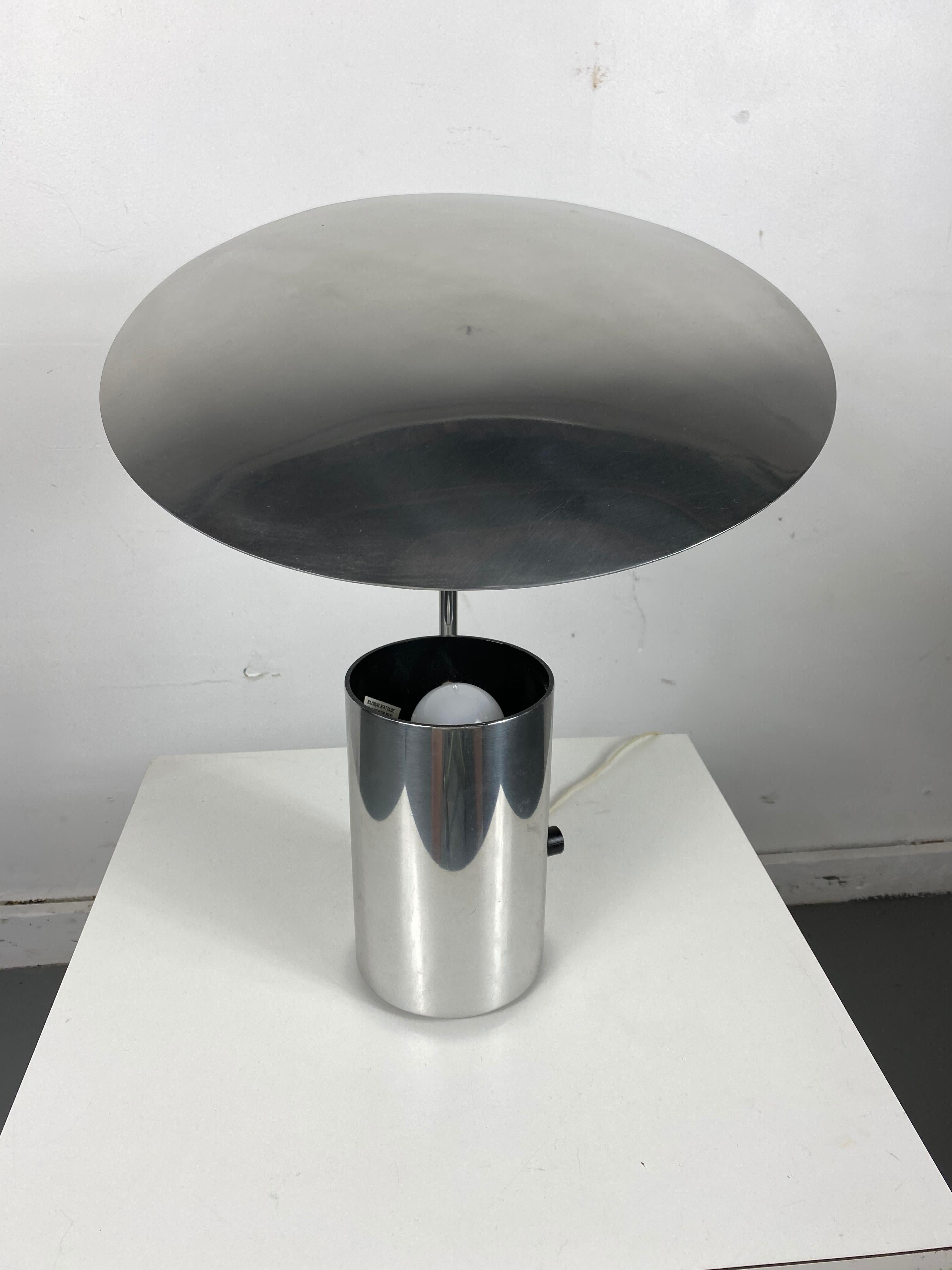Classic 20th century design. Super clean, all chromed metal geometric modern table lamp, adjustable shade, light bulb sits in a cylindrical base design. Designed by George Nelson, manufactured by Koch & Lowy, superior quality, amazing design.