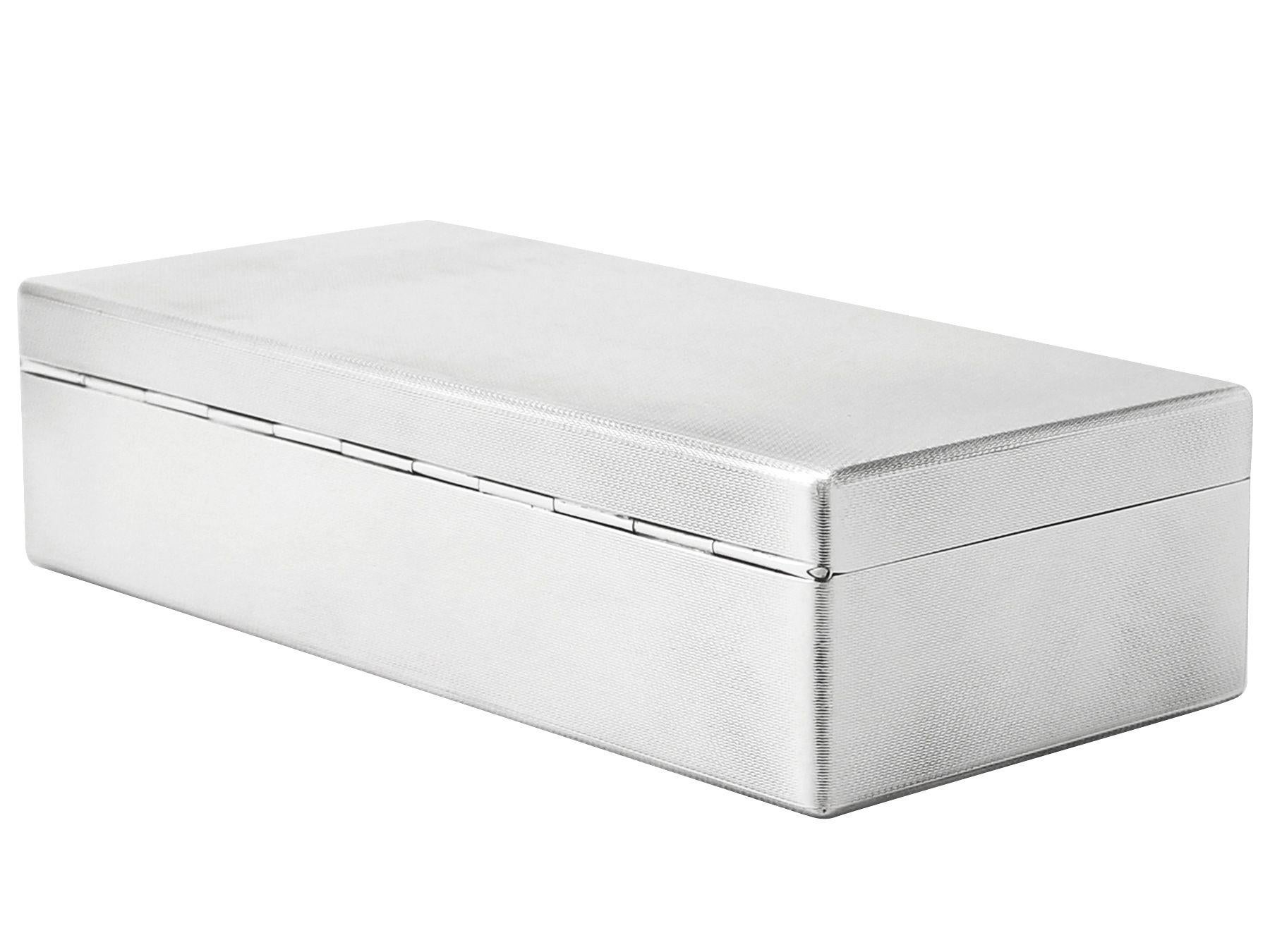 An exceptional, fine and impressive vintage George VI English sterling silver box; an addition to our ornamental silverware collection.

This exceptional vintage George VI sterling silver box has a rectangular form with rounded corners.

The