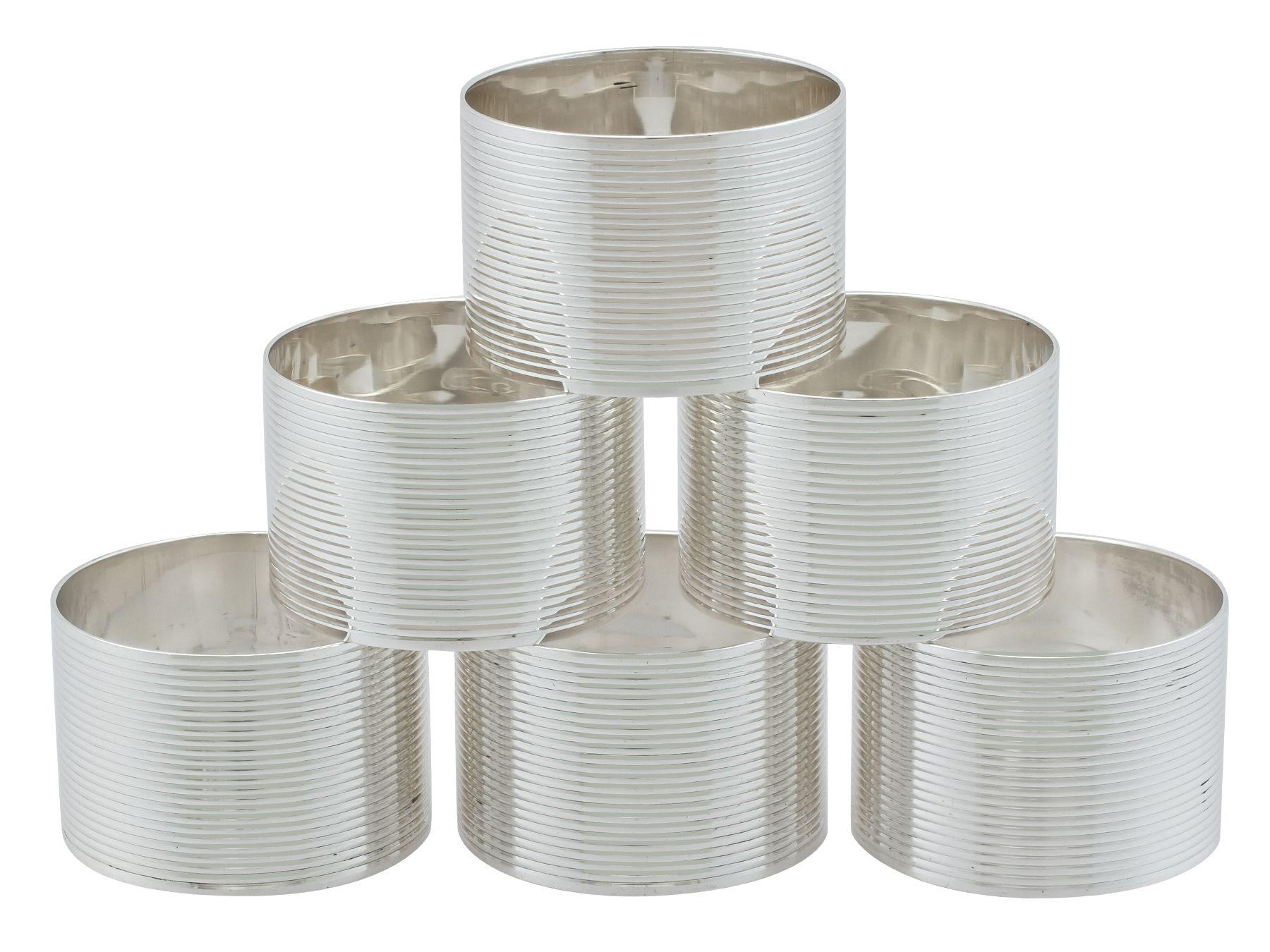 An exceptional, fine and impressive set of six vintage George VI English sterling silver napkin rings; an addition to our London silverware collection

This exceptional set of vintage silver napkin rings, in sterling standard, consists of six