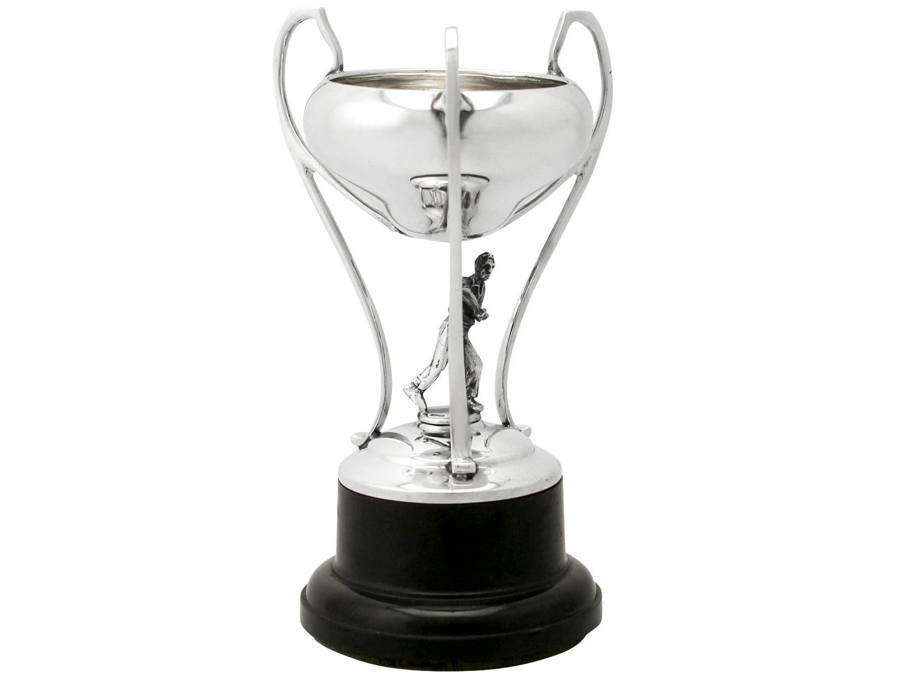 A fine and impressive vintage George VI English cast sterling silver presentation trophy in the form of a tennis player; an addition to our diverse presentation silverware collection.

This fine vintage George VI cast sterling silver presentation