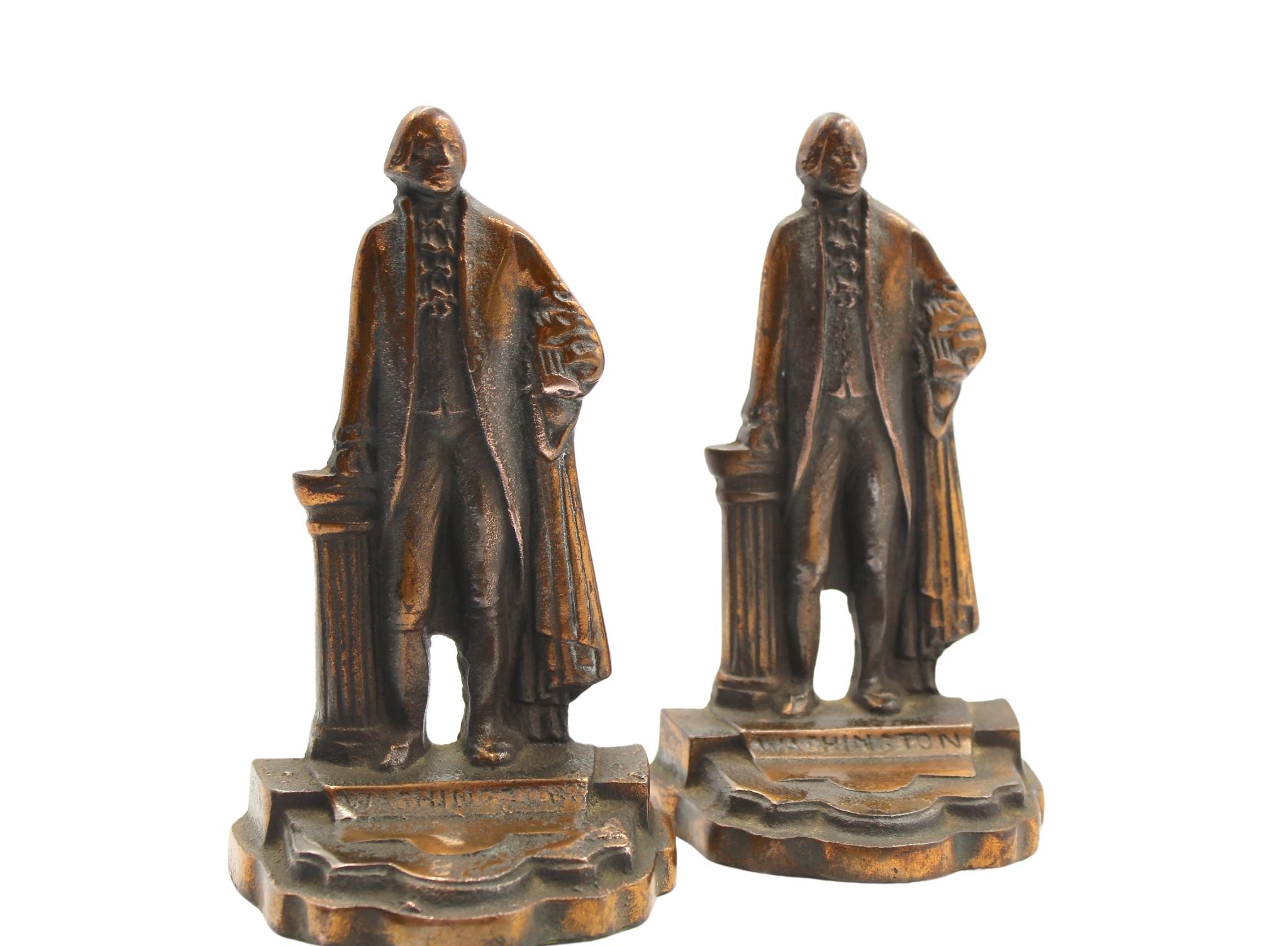 Offered is a vintage set of George Washington bookends. The bookends depict George Washington standing, with his hand resting on a classical column. Washington wears a suit with long flowing robes. The bookends have a square base with George