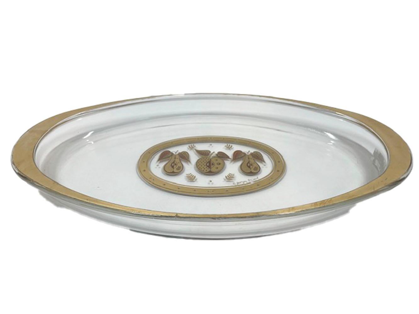 Mid-Century Modern Pyrex glass platter with a Forbidden Fruit design by Georges Briard in 22k gold and orange enamel.