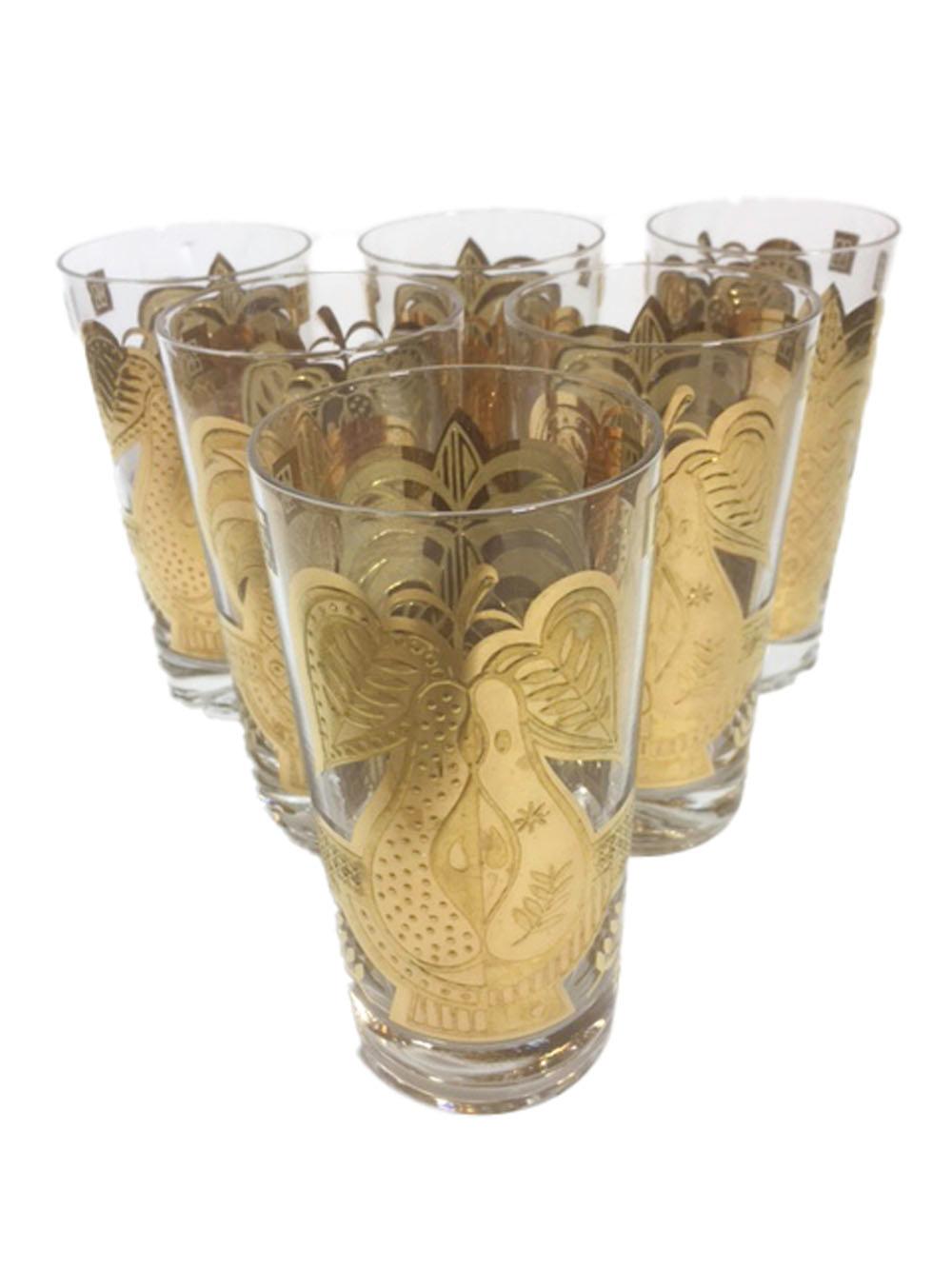 Set of 6 mid-century highball glasses designed by Georges Briard. Decorated in 22 karat gold with gloss and satin finish embossed with a large pineapple on one side and halved pear on the other. All in excellent condition.