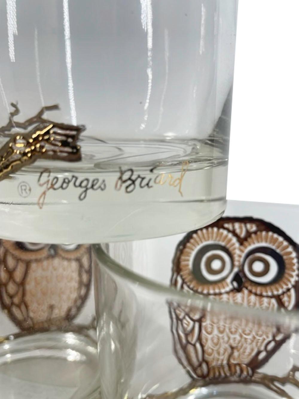 Six Mid-Century Modern rocks glasses designed by and signed Georges Briard with a large 22k gold and tan enamel owl on a branch. This 3-1/4