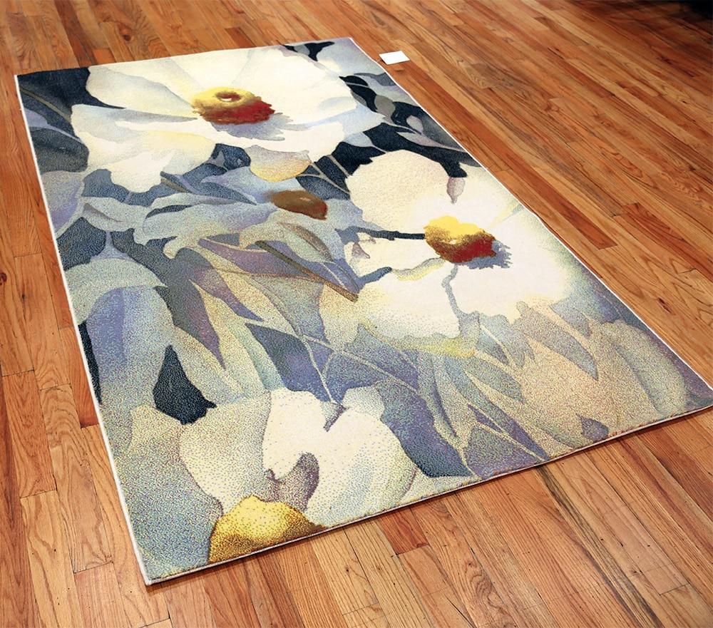 Vintage Scandinavian art rug designed by renowned American artist Georgia O’Keeffe, country of origin / rug type: Scandinavian rugs, date: circa Mid-20th century. Size: 5 ft 2 in x 7 ft 7 in (1.57 m x 2.31 m)

The beautiful floral design on this