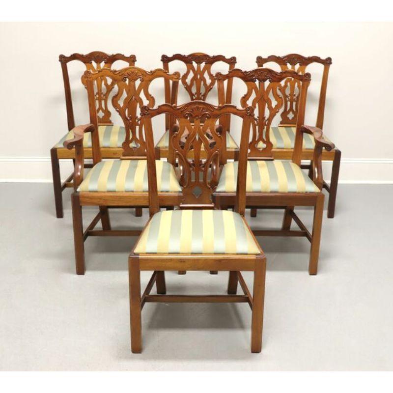 A set of six Chippendale style dining chairs by Georgian Furnishings of New Orleans, LA, USA. Solid mahogany with naturally occurring finish variations, carved back splat, sage & gold color fabric upholstered seats, stretcher base and straight legs.