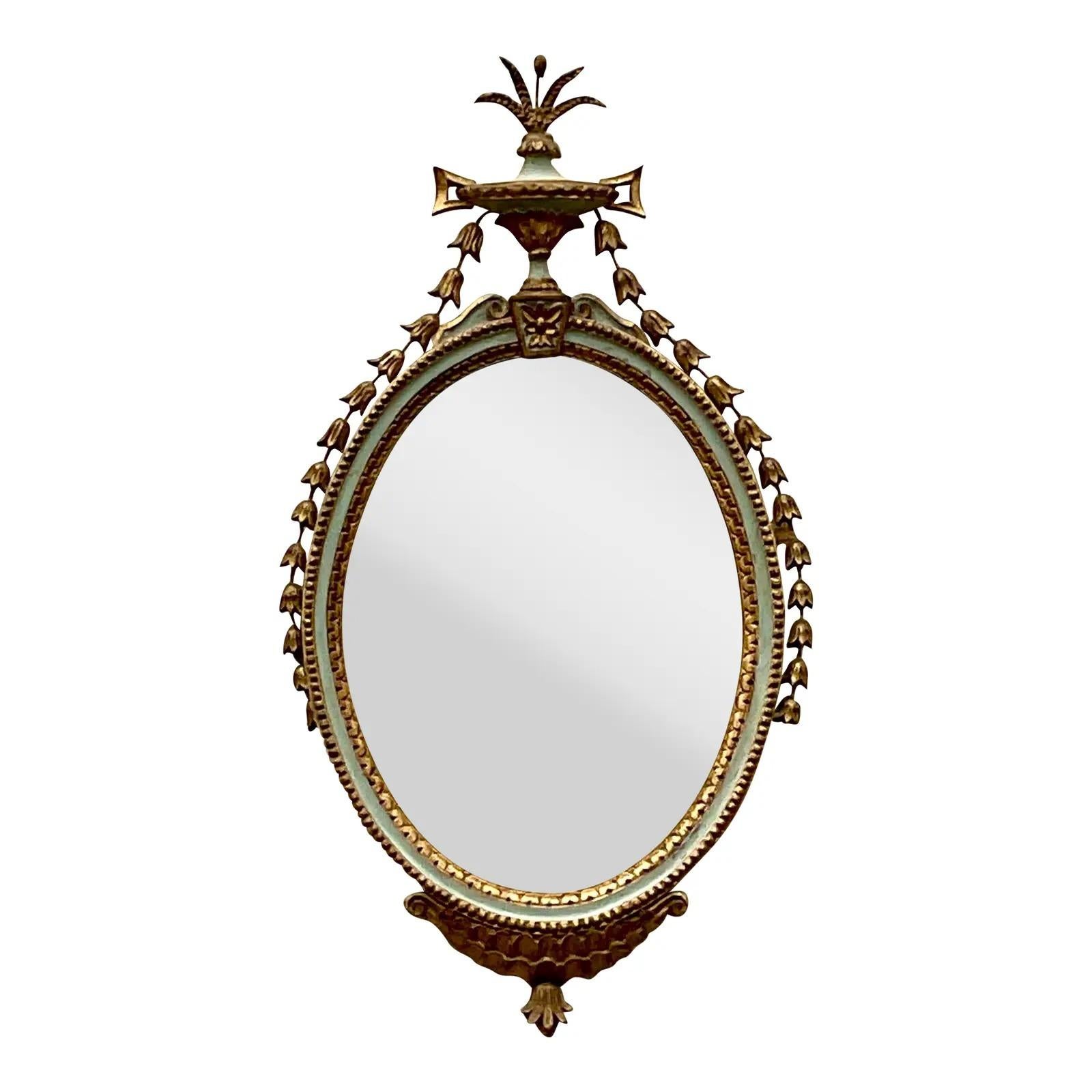 Fantastic vintage Georgian mirror. Beautiful pale grey with gilt touches. Chic hand carved garlands and flora. A real collectors item. Acquired from a Palm Beach estate.