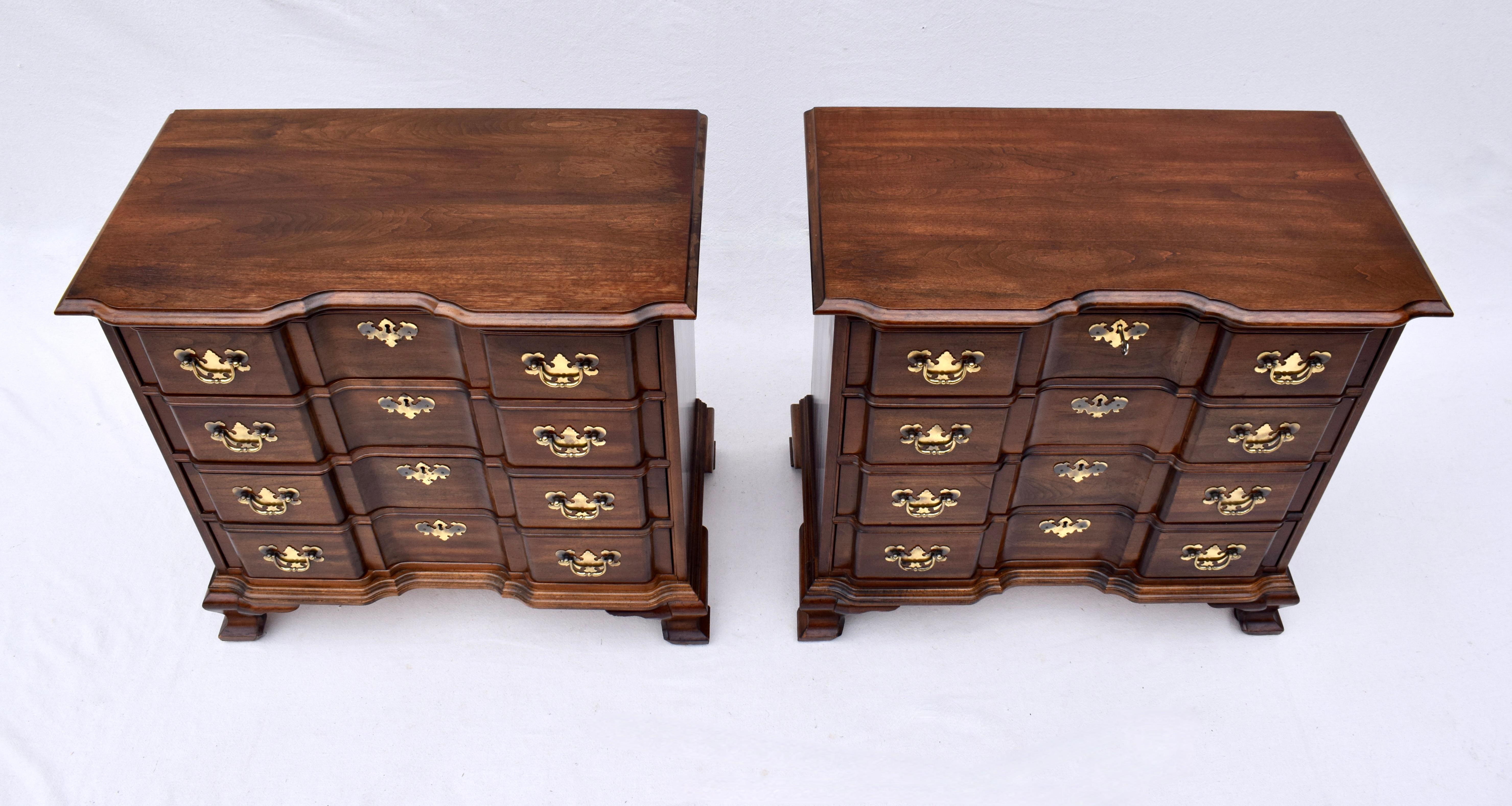 A pair of Georgian or Chippendale Goddard style Bachelor night stands in solid Walnut with original brass hardware including working locks on all drawers & key.  Generous storage of heirloom quality; timeless design.