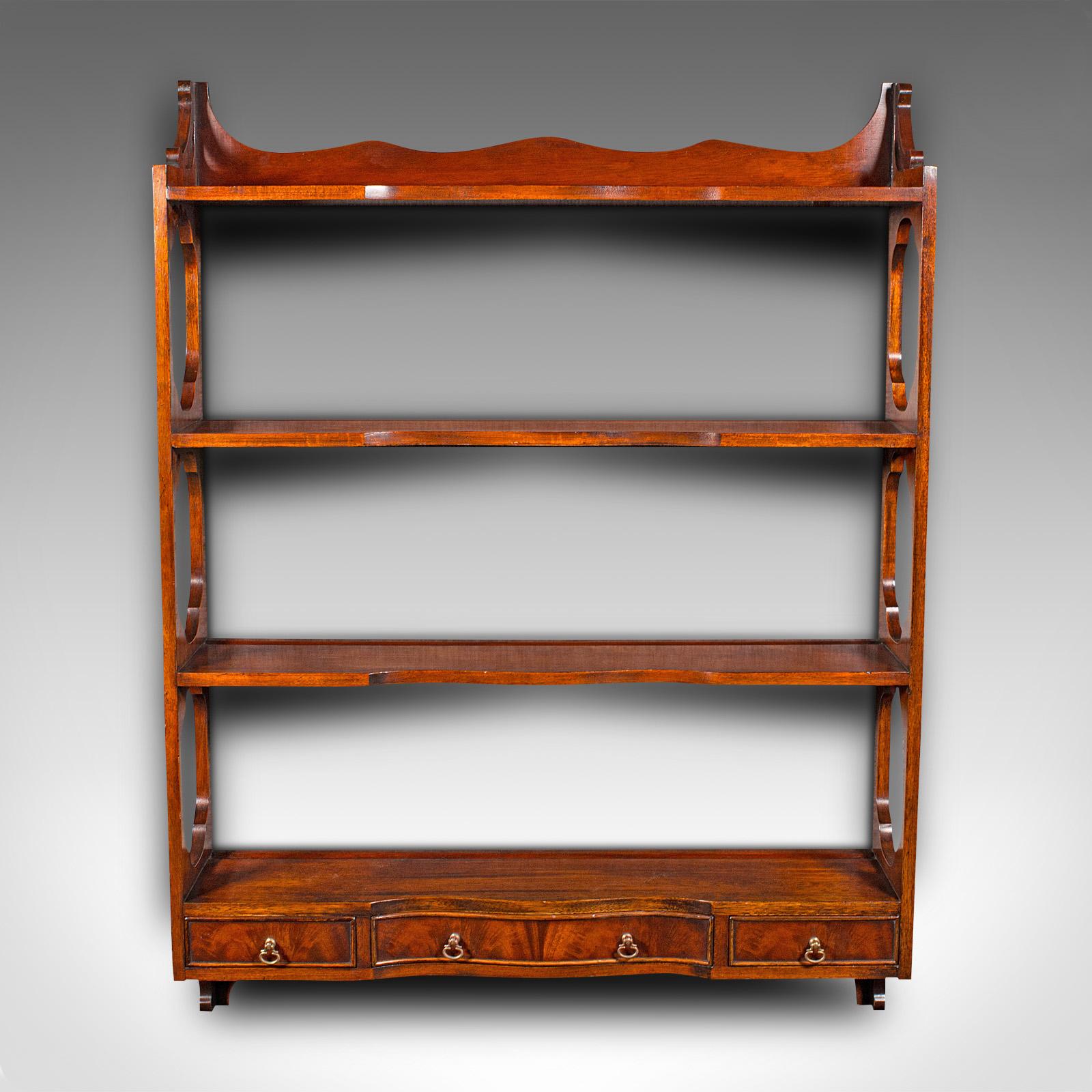 This is a vintage Georgian revival whatnot. An English, walnut set of mounted shelves, dating to the late 20th century, circa 1980.

Of superb quality, with striking detail redolent of Georgian taste
Displays a desirable aged patina and in good