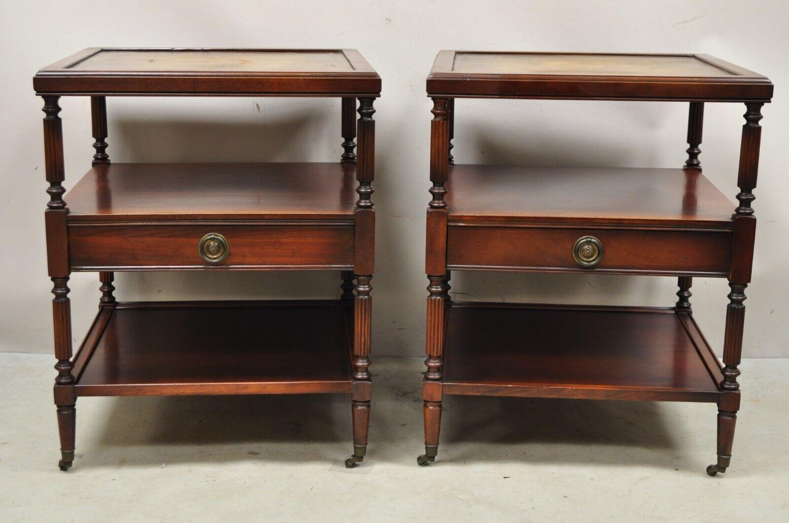 Vintage Georgian Style 3 Tier Leather Top Mahogany End Tables w/ Drawer - a Pair. Item features 3 tiers, tooled leather top, brass rolling casters, 1 dovetailed drawer, very nice vintage set. Mid 20th Century. Measurements: 26.5