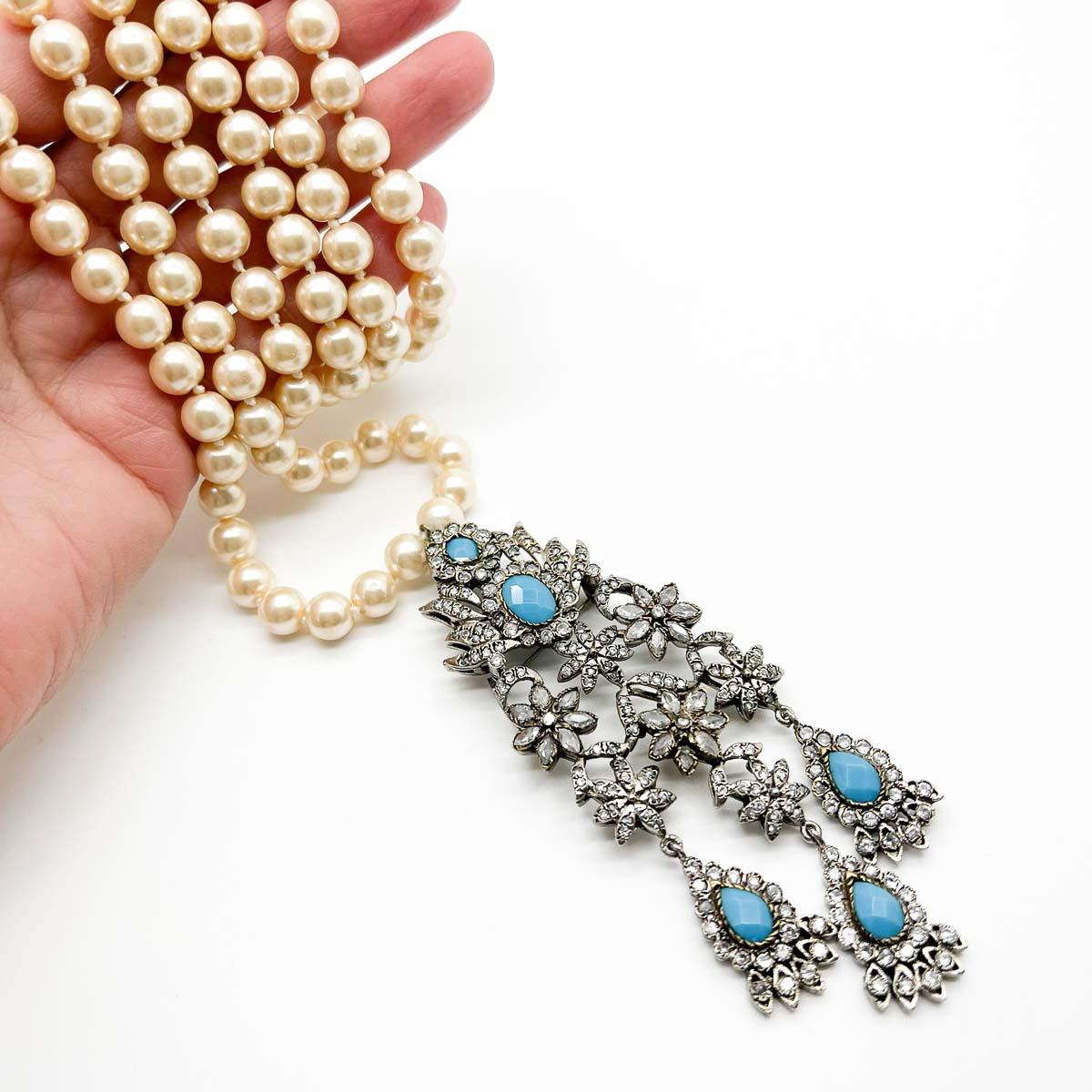 A magnificent Vintage Georgian Style Paste Necklace with turquoise and pearls. A long and elaborate Georgian style pendant is set with paste and faceted turquoise glass. The pendant can also be pinned in position either to avoid swinging or to