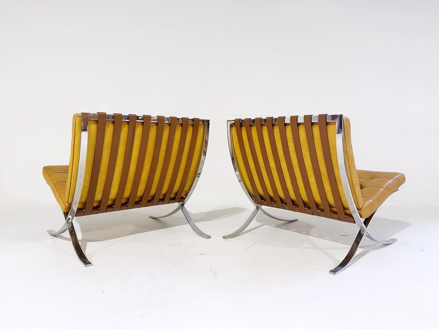 A collector's pair. This stunning pair of Barcelona chairs with ottomans were made by Gerald R. Griffith under the close supervision of Mies van der Rohe. The Griffith chairs have extremely precise corners and less reinforcement at the central cross