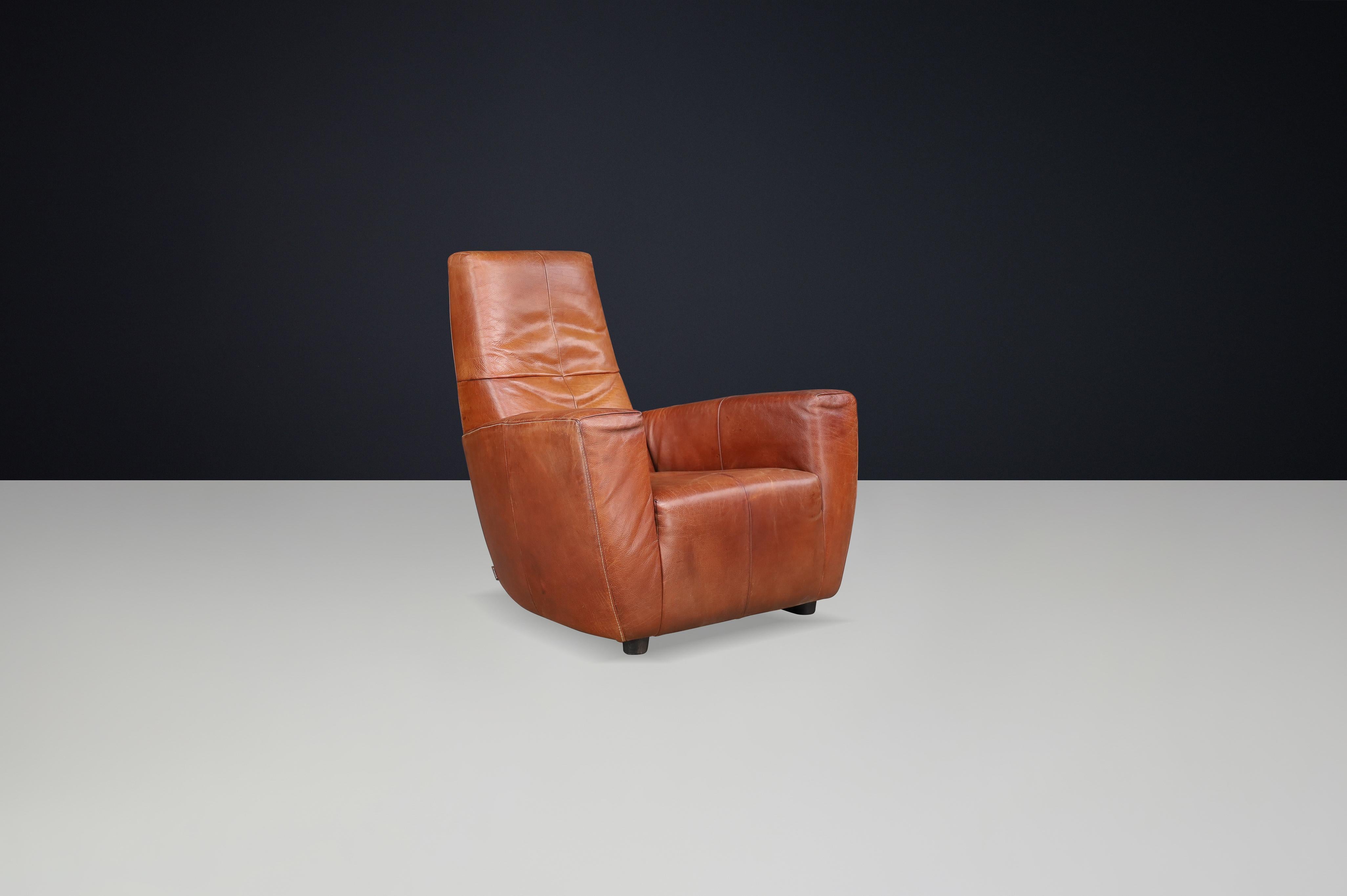 Sedia da salotto in pelle Gerard Van Den Berg d'epoca, Paesi Bassi, anni '70

Esempio straordinario di design olandese degli anni '70, questa poltrona vintage del rinomato designer Gerard Van Den Berg incarna il comfort, la maestria e la forma