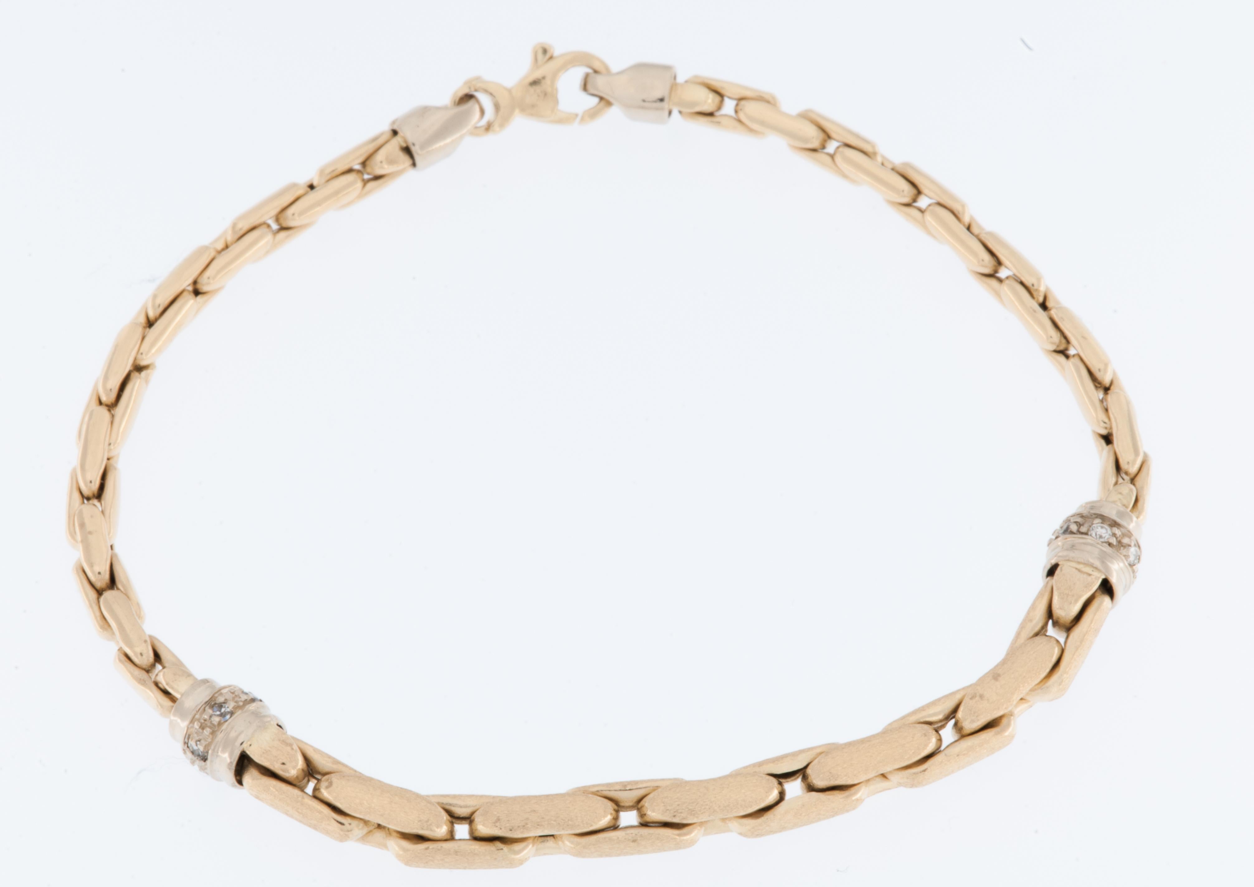 The Vintage German 14kt Yellow and White Gold Bracelet with Diamonds is a piece of fine jewelry that reflects both the craftsmanship of the era it was created in and the timeless beauty of diamonds. 

The bracelet is crafted from a combination of