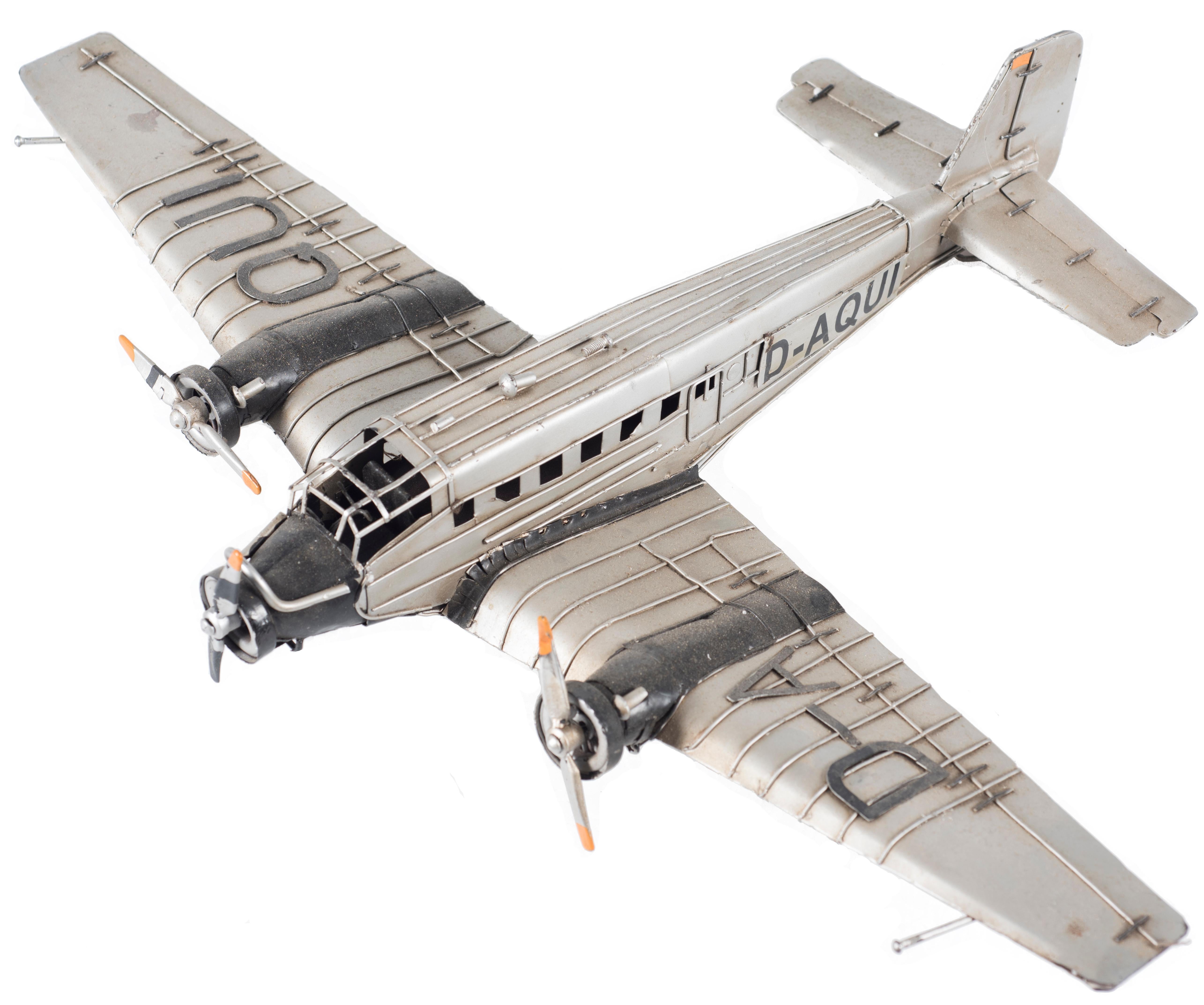 Vintage German Airplane Model of Junckers D-Aqui52/3, second half of 1900.

Original decorative object with three engines-low wings. Iron, handmade. 

Very good conditions.

 