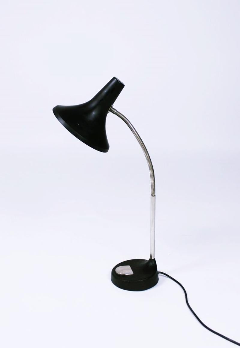 A large midcentury table or desk lamp with chrome details and a black shade with an organic-shaped cast iron base. The lamp was produced and labelled by Hillebrand and remains in very good original condition.
Designer Hillebrand, Egon
Maker