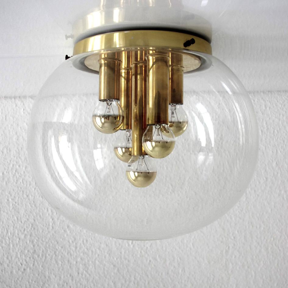 Beautiful handblown bubble glass globe and brass ceiling or wall flush mount.
Germany, 1970s.
Lamp sockets: Five.
 