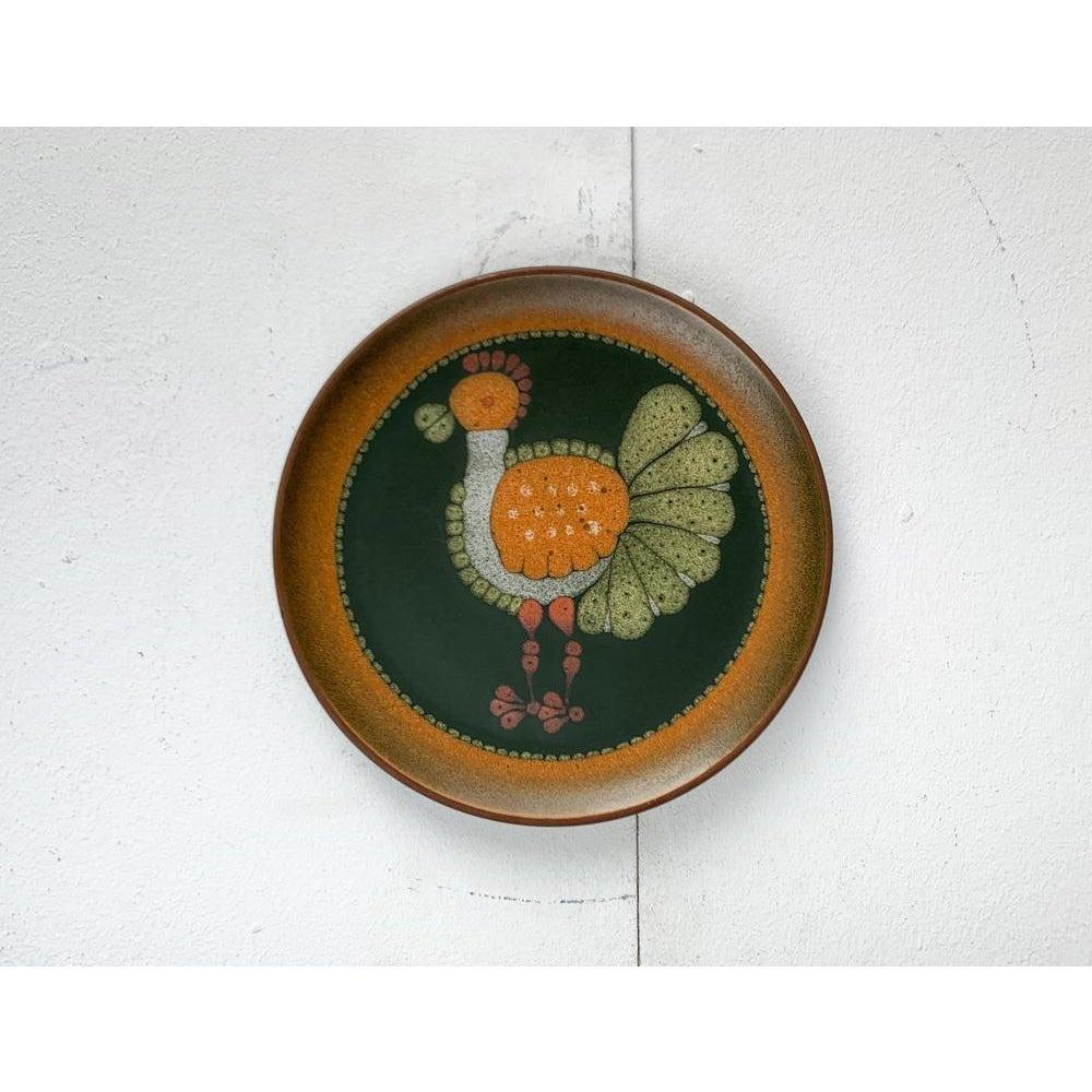 Vintage German Ceramic Wall Plate mit Vogelmotiv von Keramik Manufaktur Kupfermühle, 1970er Jahre, in sehr gutem Zustand. Entworfen 1970 bis 1979 offizieller Echtheitsnachweis wie Vintage-Kataloge, Designer-Schallplatten.

Zusätzliche