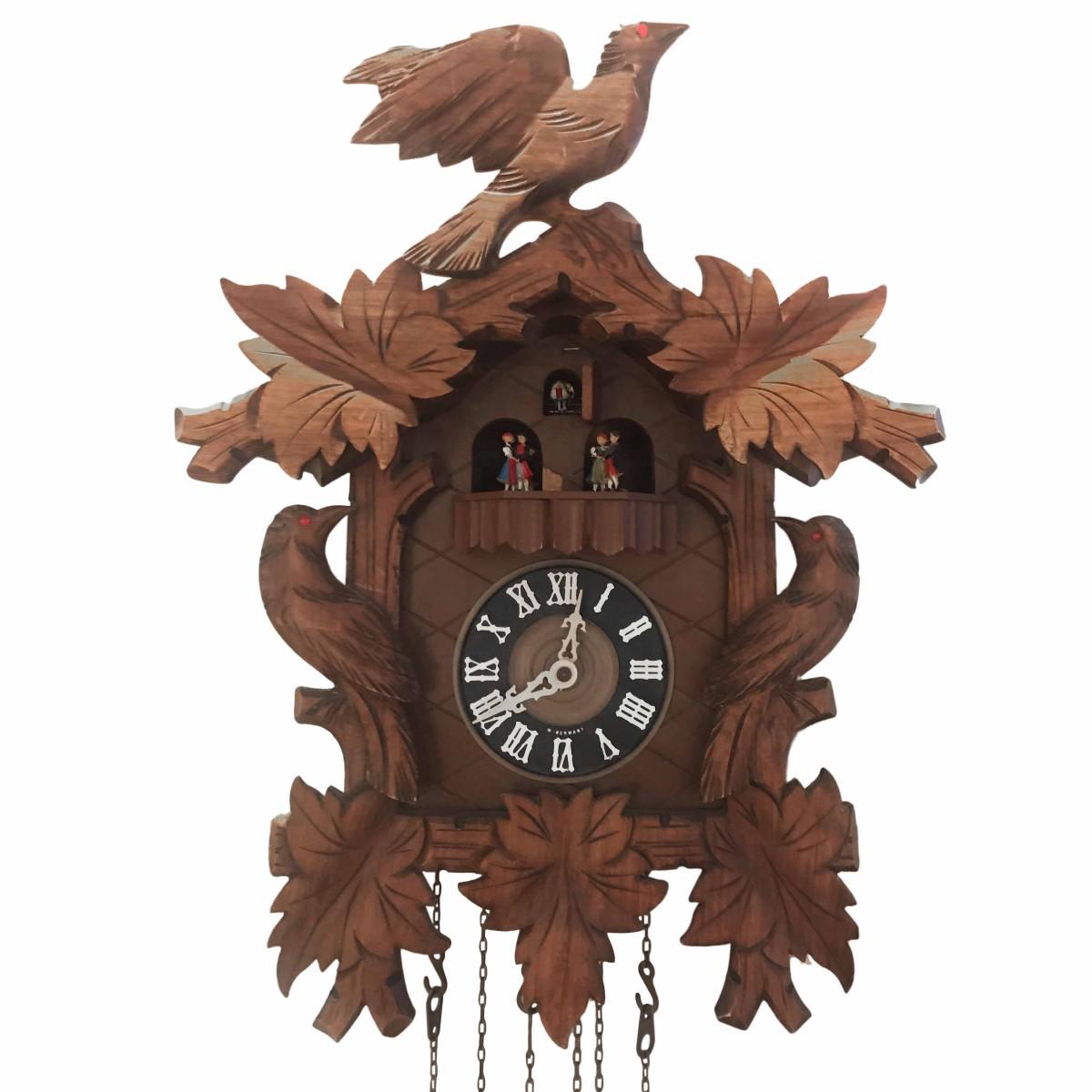 A vintage cuckoo clock. Germany, circa 1950. Designed to hang on wall.

Dimensions: 13 inches L x 8 inches D x 18 inches H.