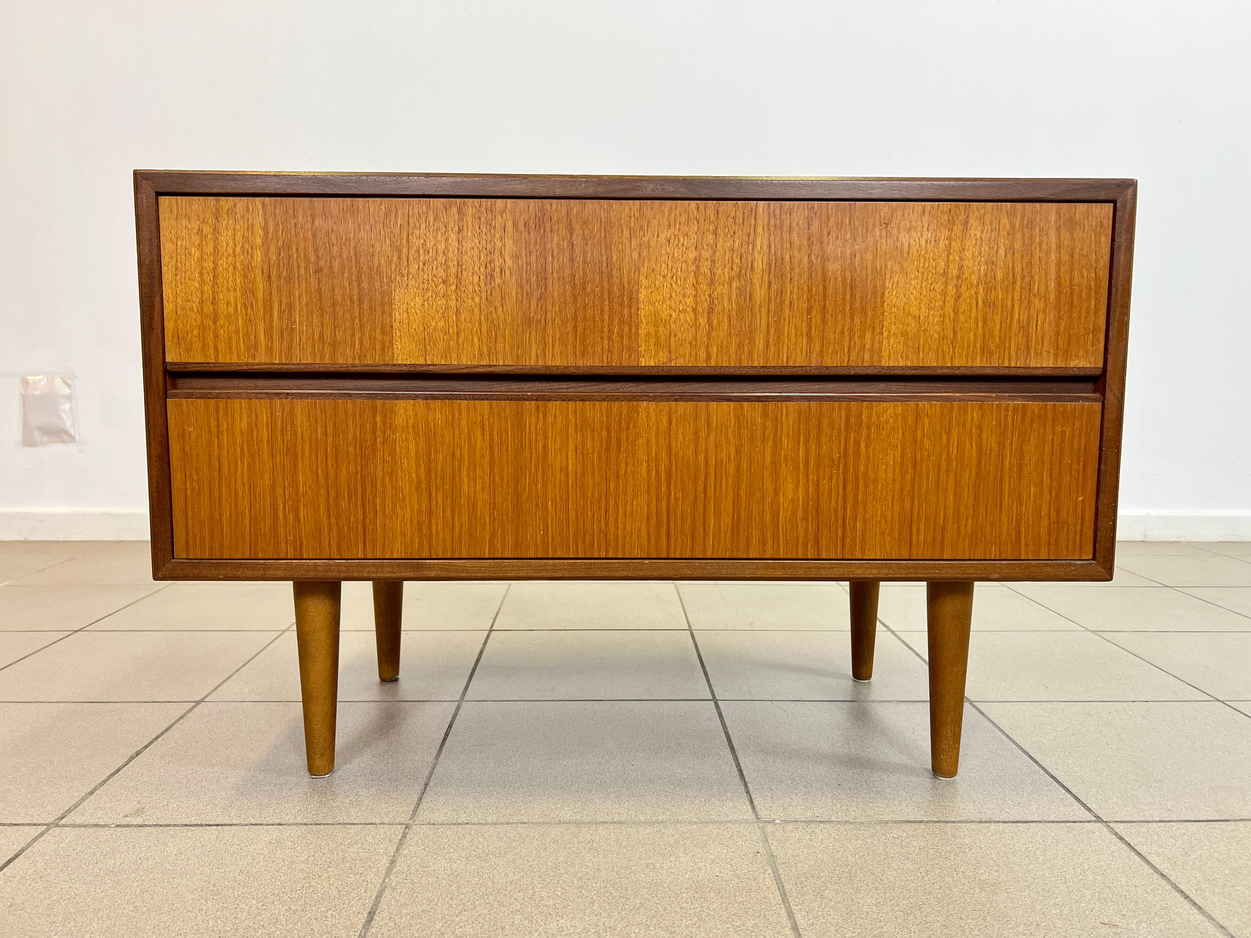 Dimensions: H 22” x W 33.5” x D 15.7”

Vintage West Germany dresser with 2 drawers, from 1960s.

Please see our other listings for ideas and matching pieces.

Condition: Vintage condition consistent with age, present scratches. Please observe the