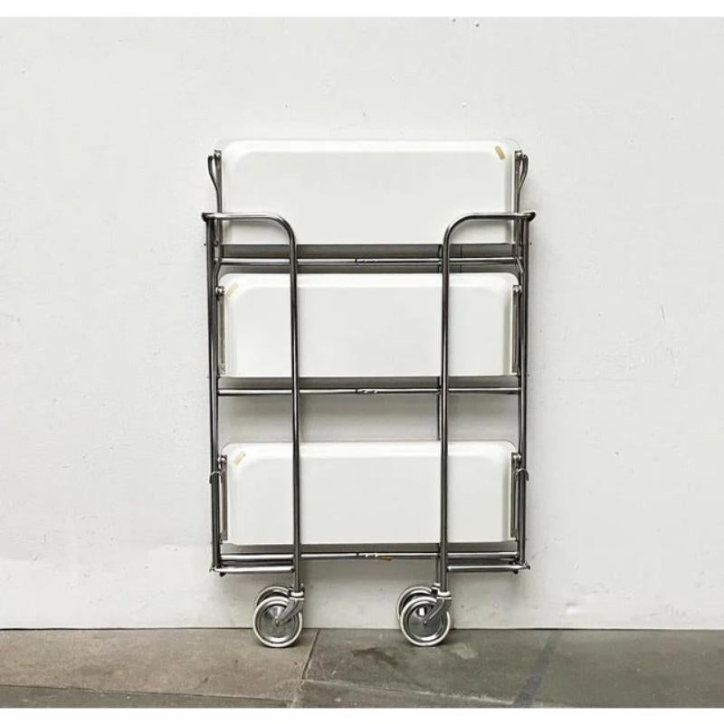 Dinett serving car in a rare version with three levels.

a particularly functional furniture. Perfect for the home bar or as a side table. The car is foldable and is particularly easy to stow. This is a particularly rare version with an additional