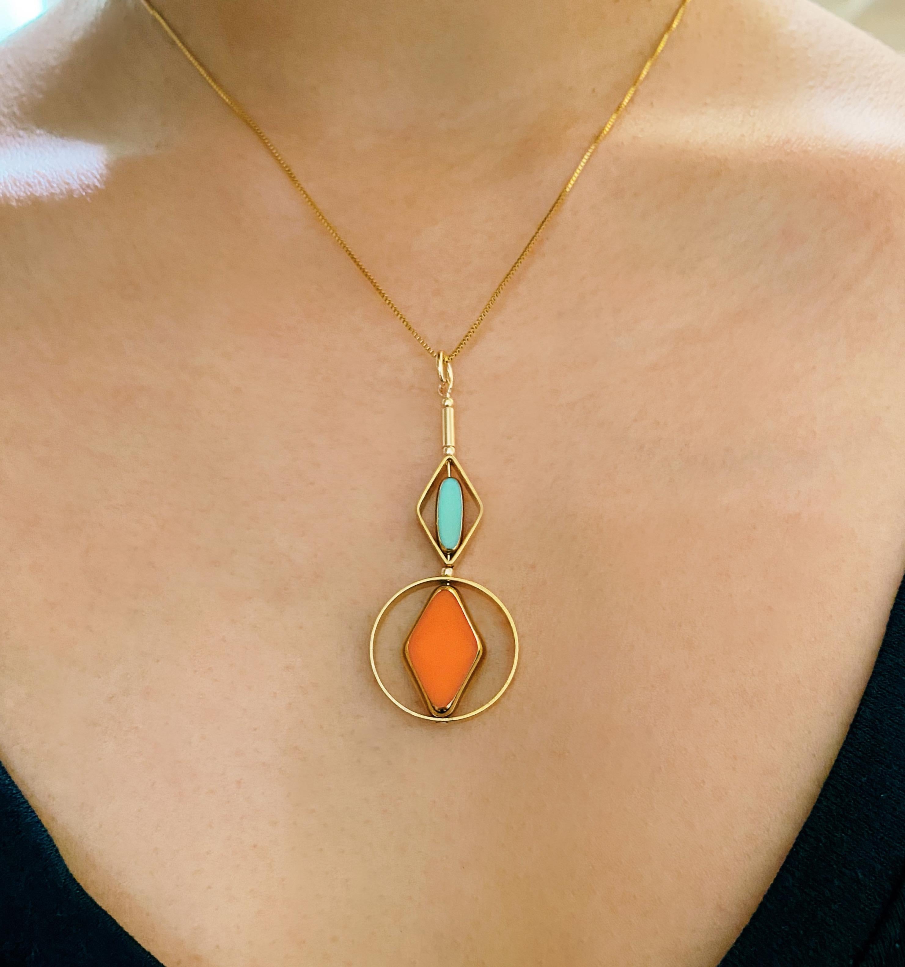 The pendant consist of an orange-red diamond and mini baby blue oblong shaped beads and finished with a 16 inch gold filled chain.

The beads are new old stock vintage German glass beads that are framed with 24K gold. The beads were hand pressed