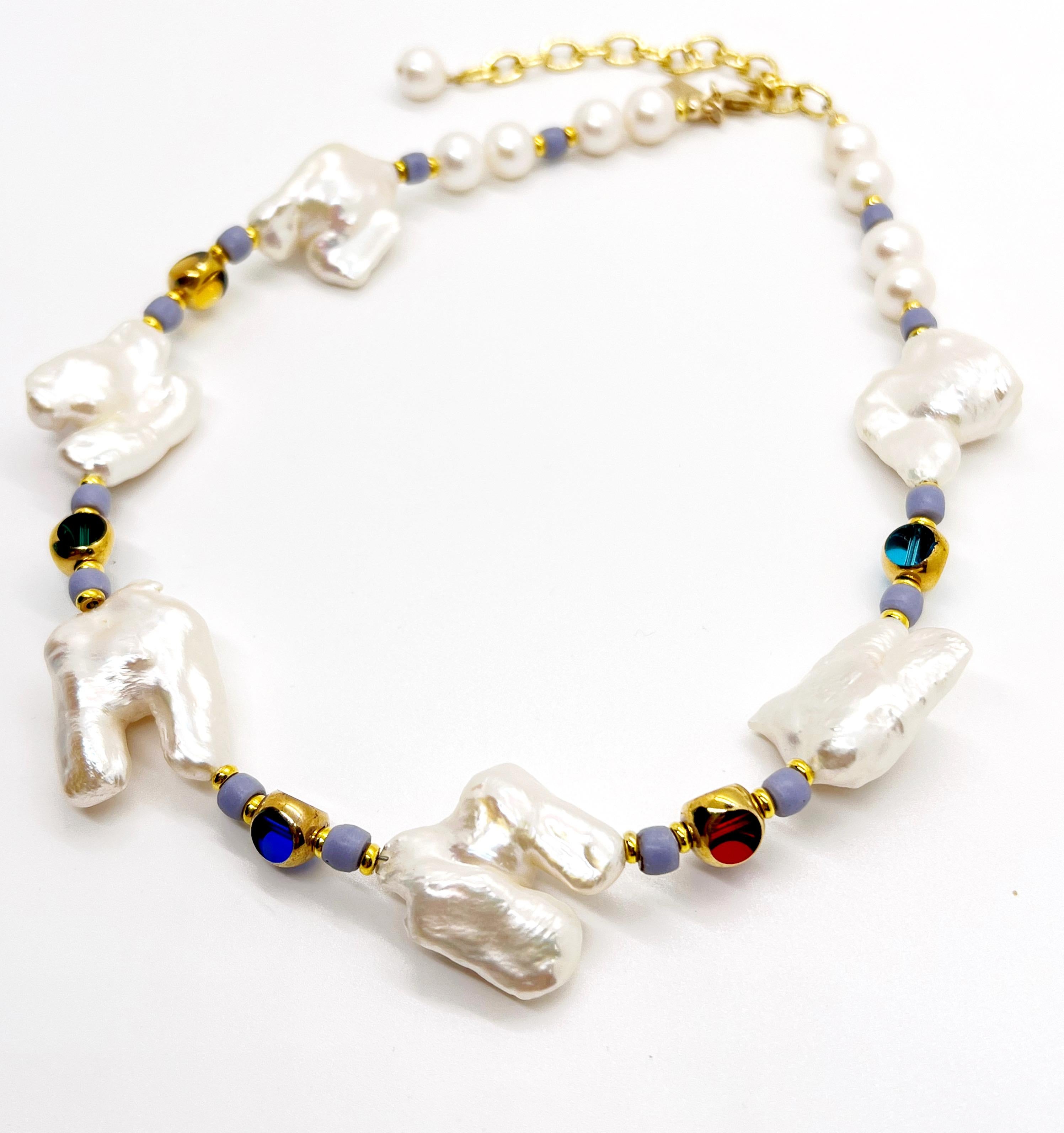 This necklace is composed of double Biwa pearls that are complimented with transparent colorful German vintage glass beads that are edged with 24K gold and lavender African Masai beads. It is measured at 16.5 inches and can be extended to about 20