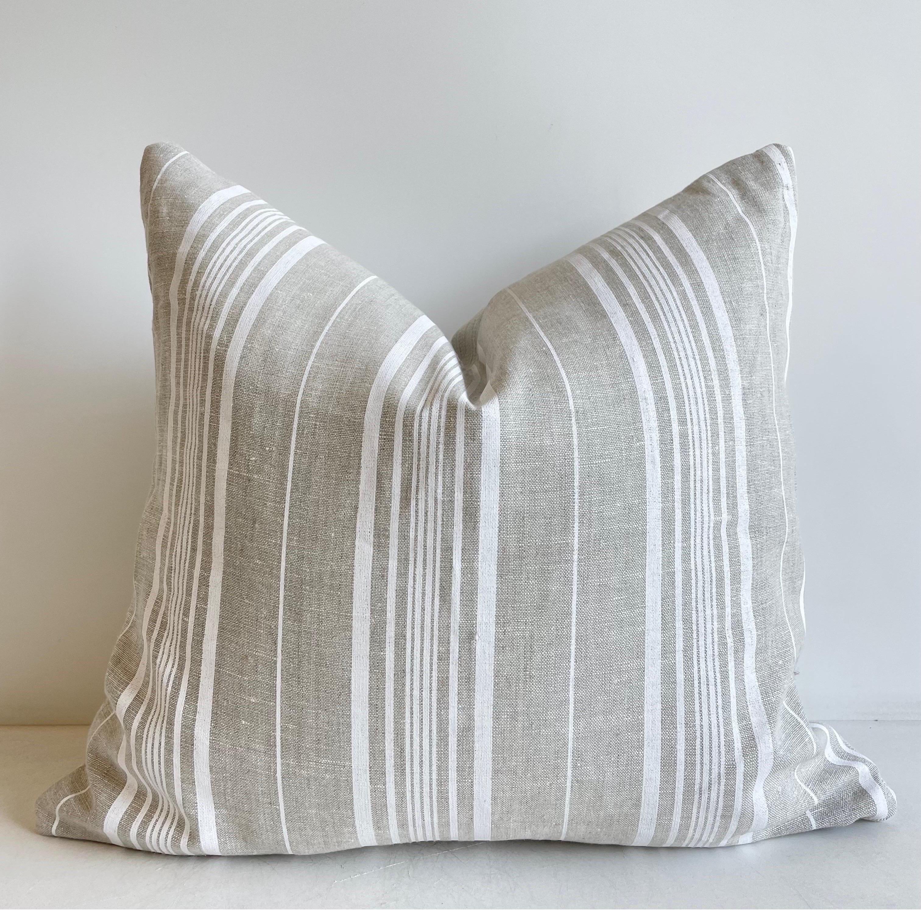 Antique grain sack pillow.
Lovely grain feed sack pillows from Europe. We custom-made these out of the original antique feed sacks, with brass zipper closure and overlocked edges. The backs French linen ticking stripes. All items have been pre