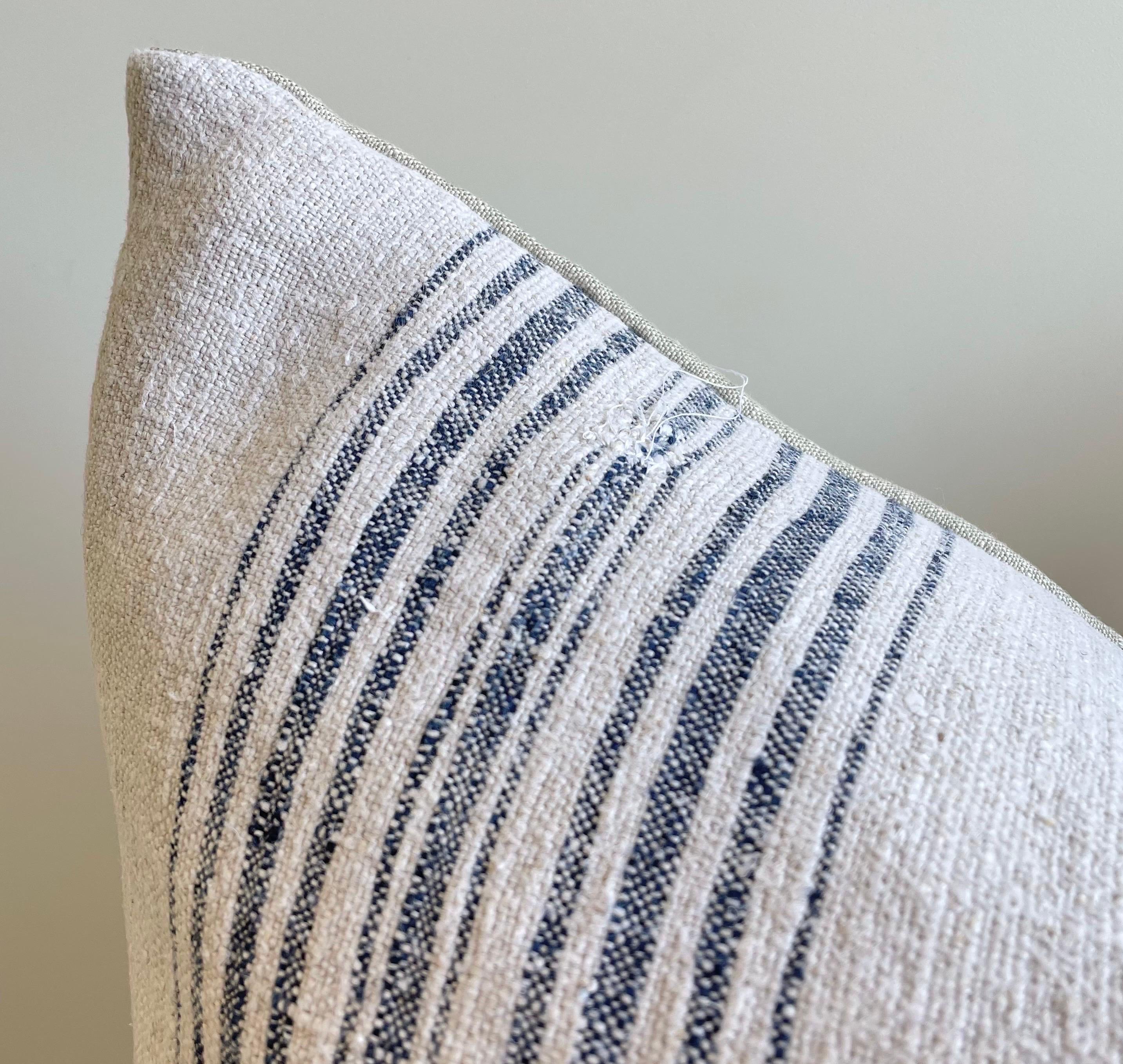 Grainsack pillows Lovely grain feed sack pillows from Europe. We custom-made these out of the original antique feed sacks, with brass zipper closure and overlocked edges. The fronts are original woven linen and hemp with stripes in indigo and off