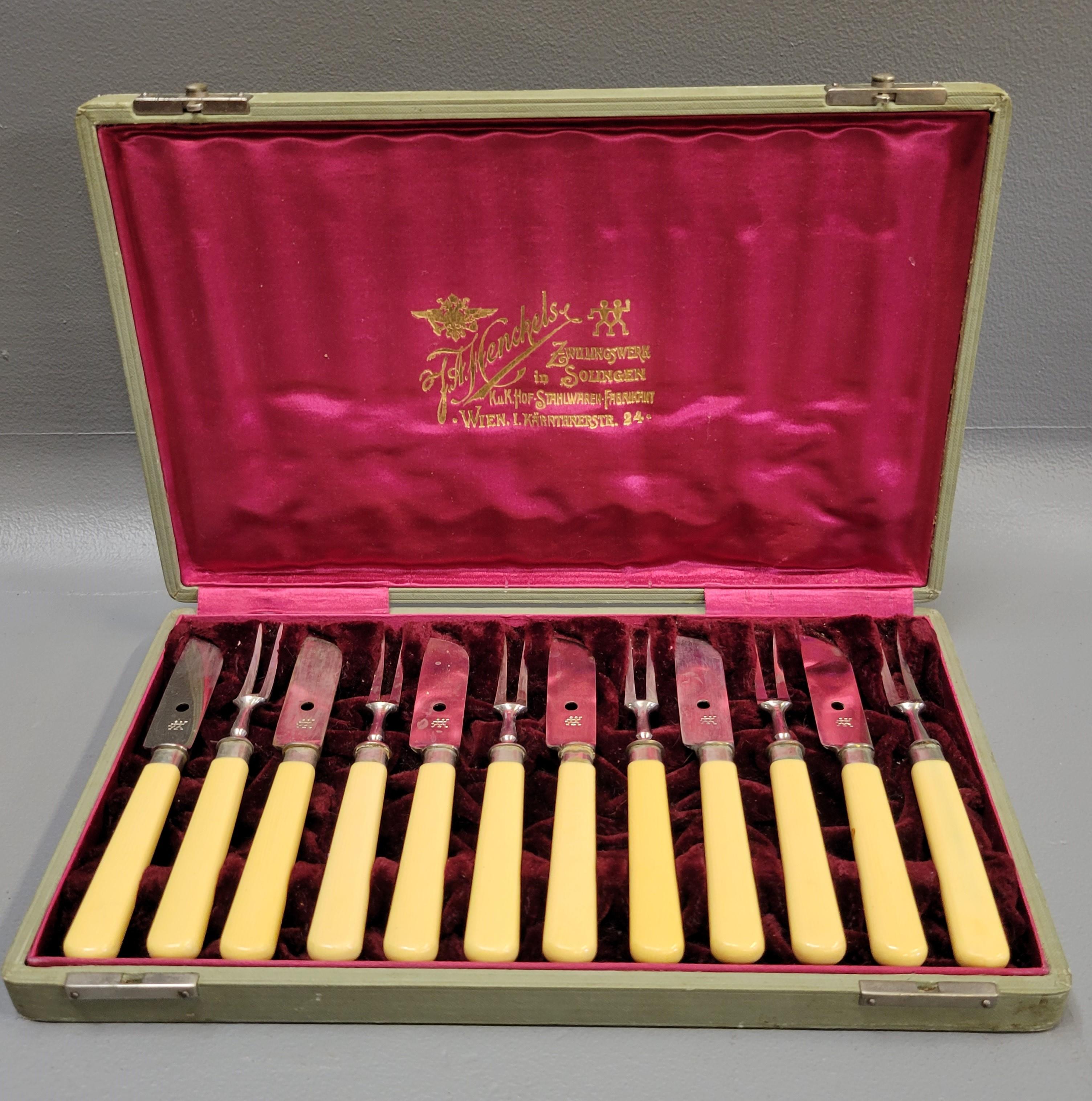 This vintage 1920s J.A. Henckels cocktail set in its original presentation box would make a lovely and unique hostess or wedding present. Blades and forks made of stainless steel; handles made of bakelite. Box is intact. 
Complete set in its