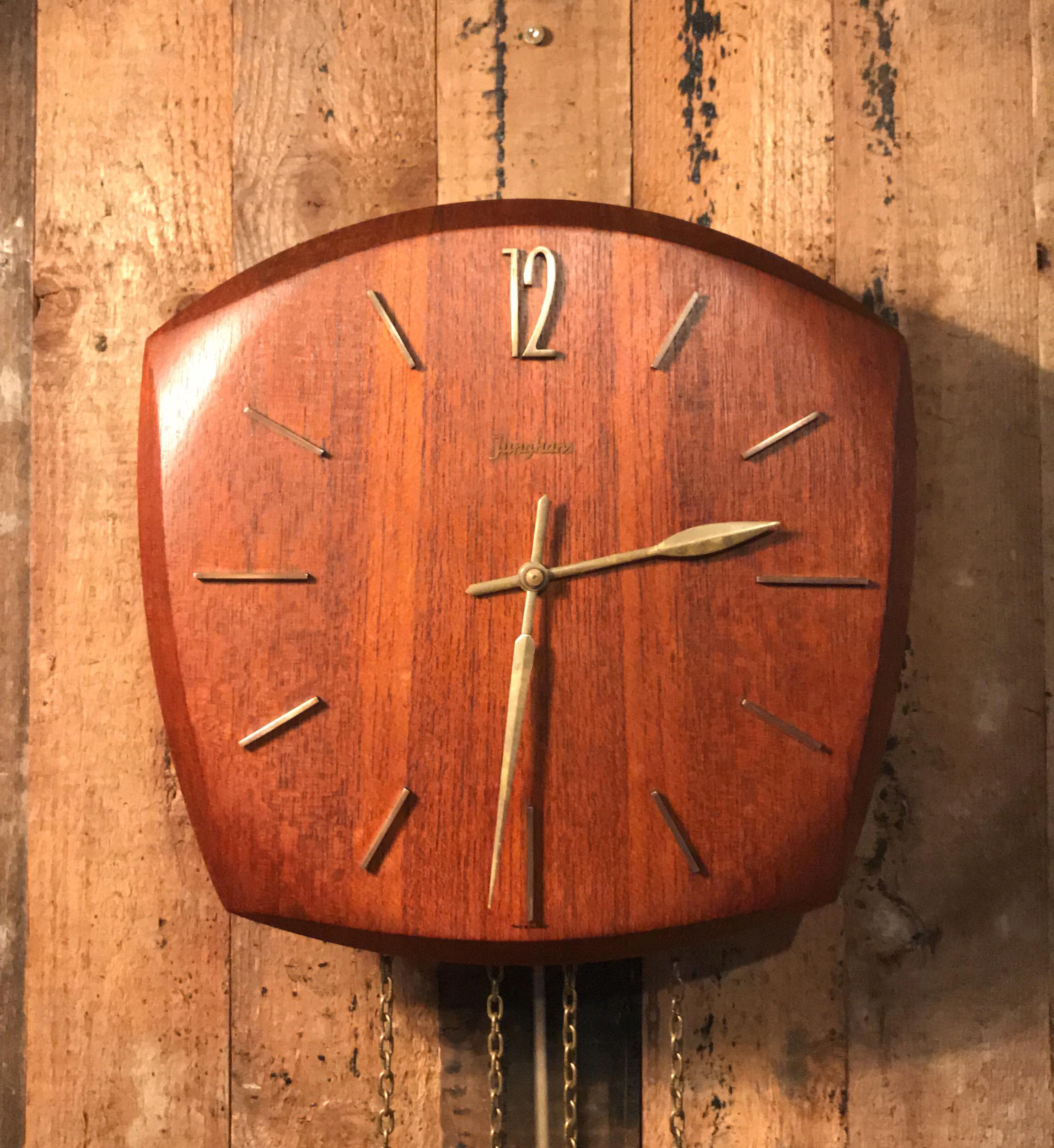 Very handsome teak and brass pendulum wall clock made by Junghans of Germany in classic midcentury design
Two weights one for the chime which strikes on the half hour and hour and one for the clock mechanism
The chime is very pleasant but can be