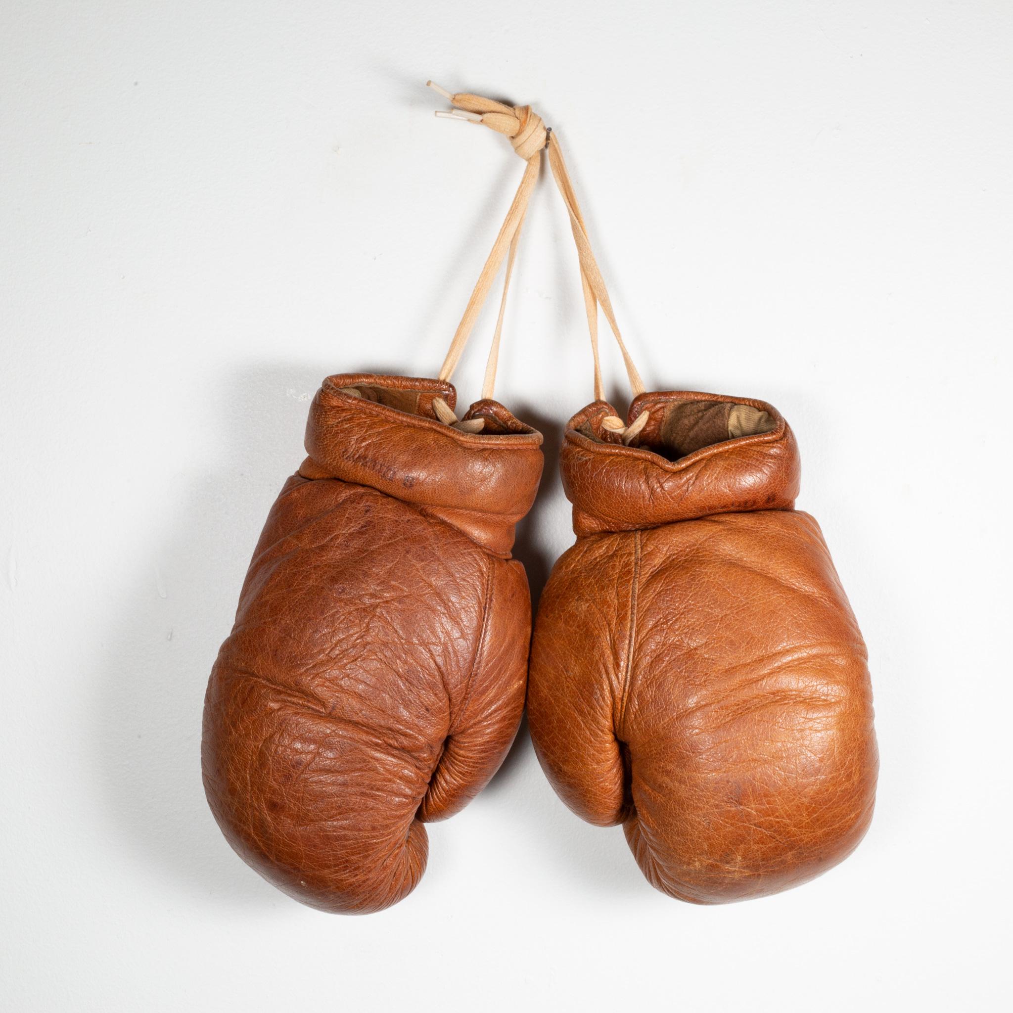 ABOUT

Original German boxing gloves with brown leather filled with horse hair. The leather is very soft and in good condition. Original label in the inside off each glove.

Creator deha, sport-prostler, frankfurt, germany.
Date Of Manufacture