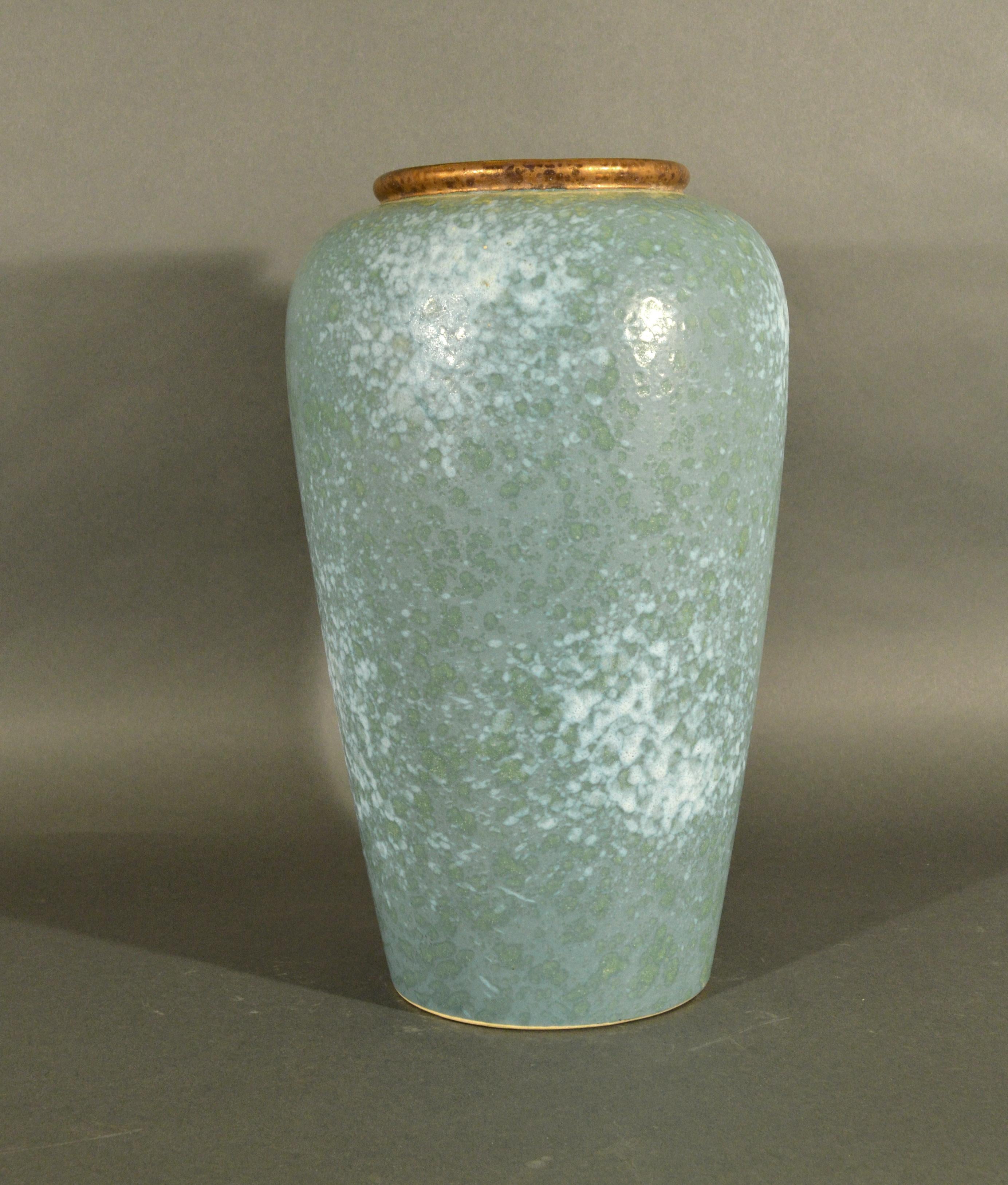 Vintage German Mid-Century Modern art pottery vase,
Scheurich Keramik,
Germany,
Early 1970s.
(NY9380-Xur)

A Sheurich tall floor vase faux-stone glaze.

Mark: Mold-marked with the Scheurich mark in the center of the bottom, surrounded by W.