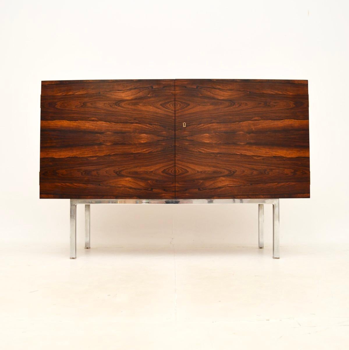 An absolutely stunning vintage sideboard, this was made in Germany and dates from the 1960’s.

It is of outstanding quality and is a lovely, very useful size. The wood is beautifully bookmatched all over, giving an extremely striking effect. There