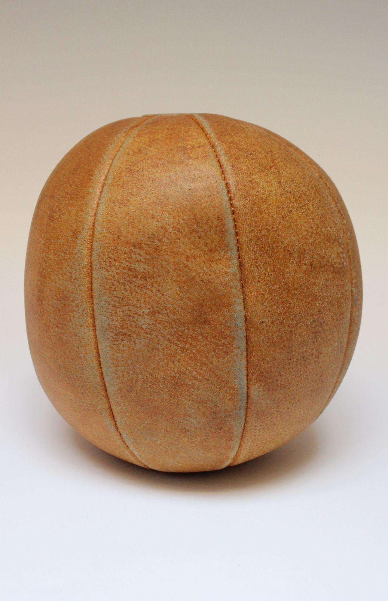 Leather medicine ball, circa 1940s, Germany.
Perfectly aged patina with natural wear/soiling present, as shown.
H: 13