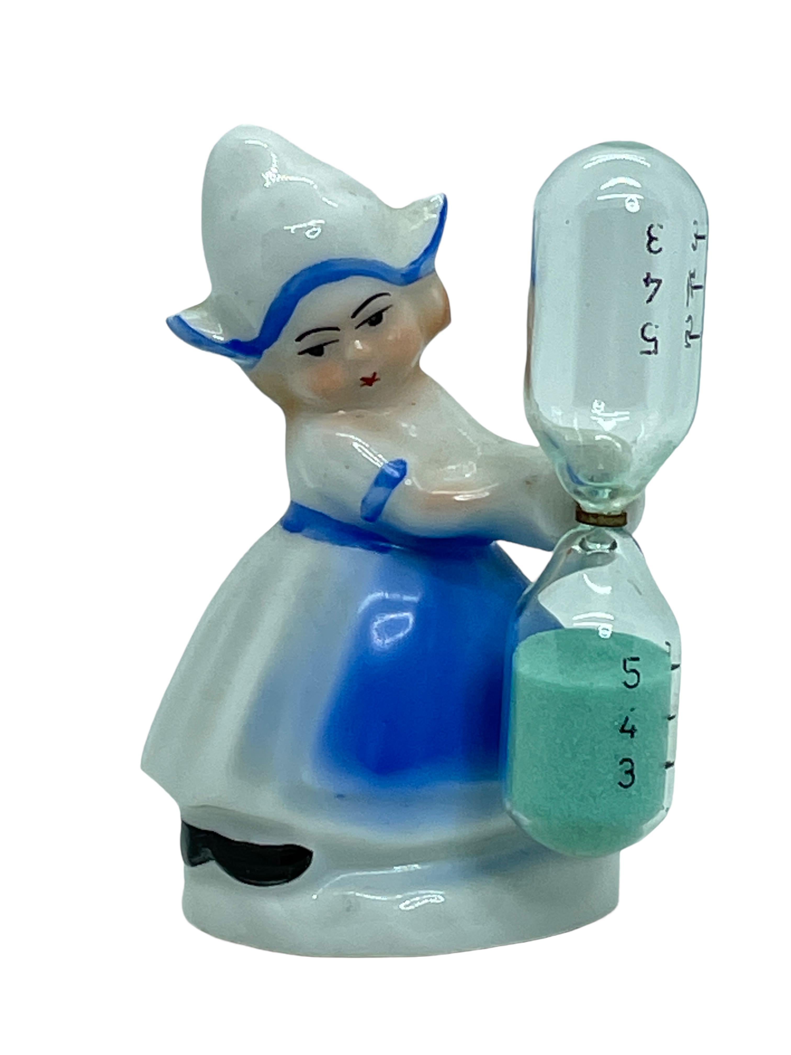 Beautiful girl figurine handmade in Germany circa 1900s- 1910s. A beautiful piece for decorating your kitchen. Handmade and hand painted in beautiful colors. Marked Germany.