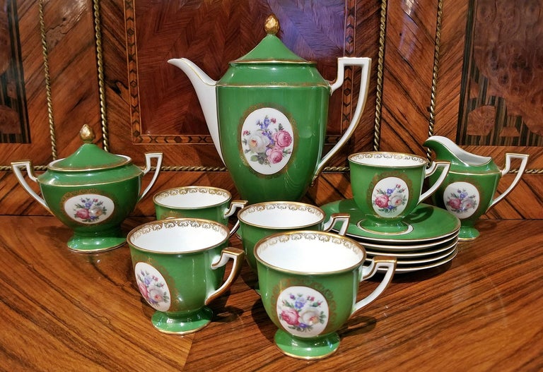 Complete porcelain/china coffee set……coffee pot, creamer, sugar bowl and 5 cups and saucers.

German…… Royal Tettau 1794……fully marked…….”Royal Tettau”….”Germany”……”US Zone”.

Marked for 1946-1949.

Green exterior with white interior. The
