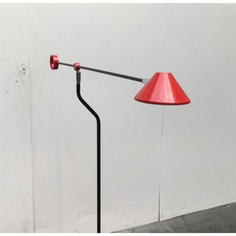 Floor lamp in postmodern design language from the German manufacturer Honsel.

Particularly striking is the play with shape and color. Relevant elements such as the base, head and joint, etc. are designed as basic shapes such as circle, cone,