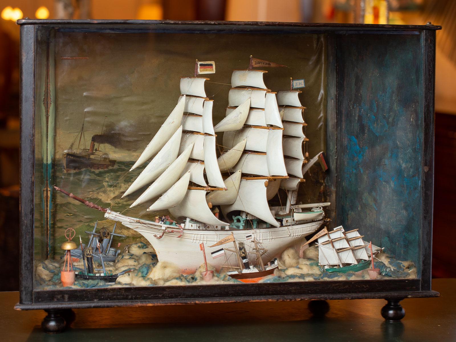 A fantastic vintage German handmade sailing ship diorama circa 1940 of the Hoffnung, a square rigged barque. This large exhibition case retains its original glass front panel and original case and painted finish on the exterior with wonderful