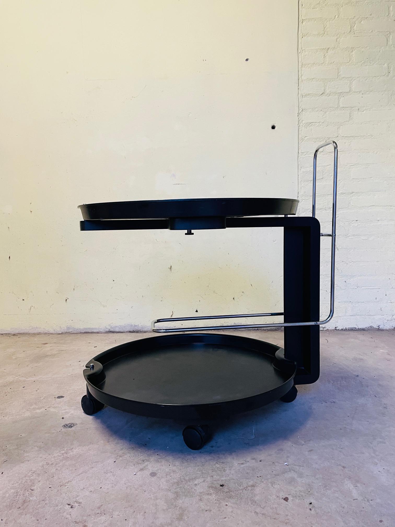Service trolley 1980s Rosenthal by Waldemar Rothe.
Elegant Service bar Cart designed by Waldemar Rothe for Rosenthal, Germany.

The beautiful designed cart has a special holder which fits three bottles and two removable trays which can be used to
