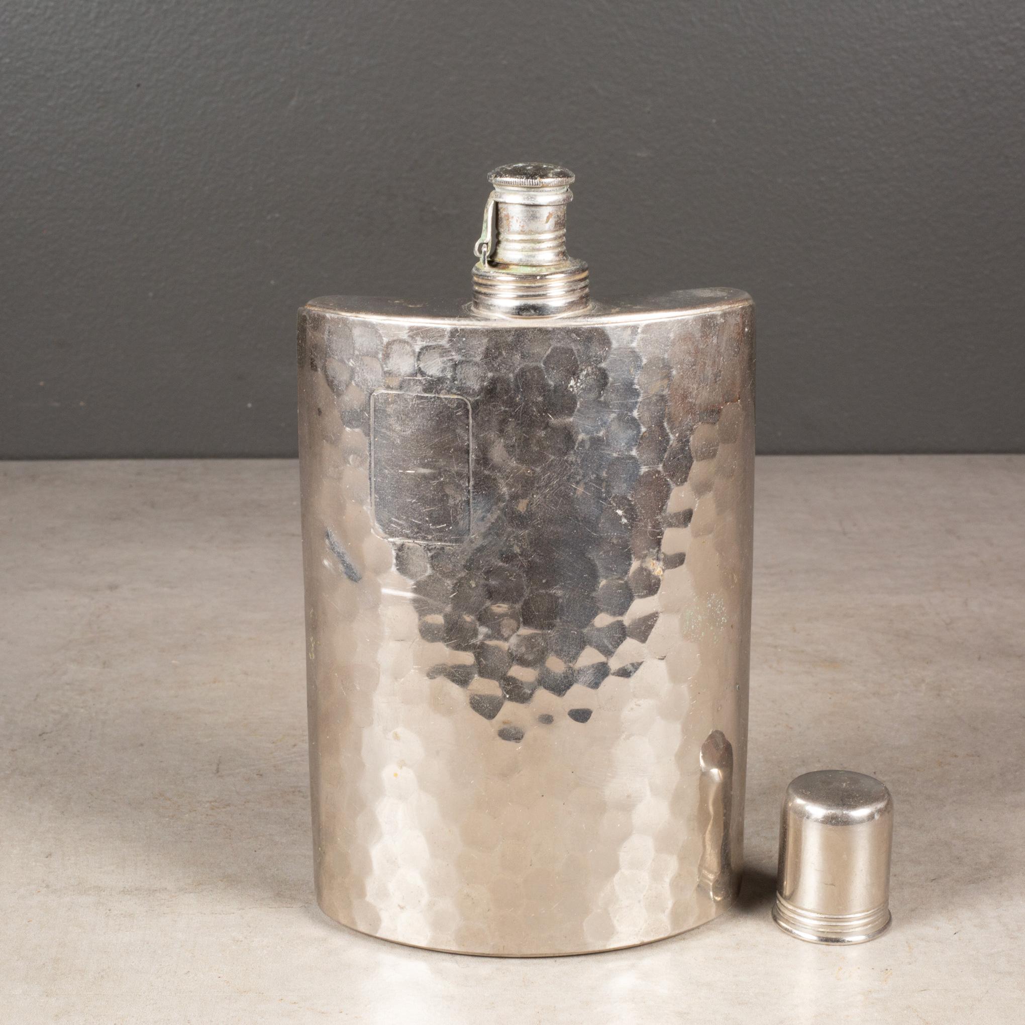 ABOUT

A hammered silver plated hip flask lined with tin, made in West Germany. This 10 oz. flask has a flip top with a cork interior. A rectangular space on the front for engraving. 

Shown with life size hand model for scale. 

    CREATOR