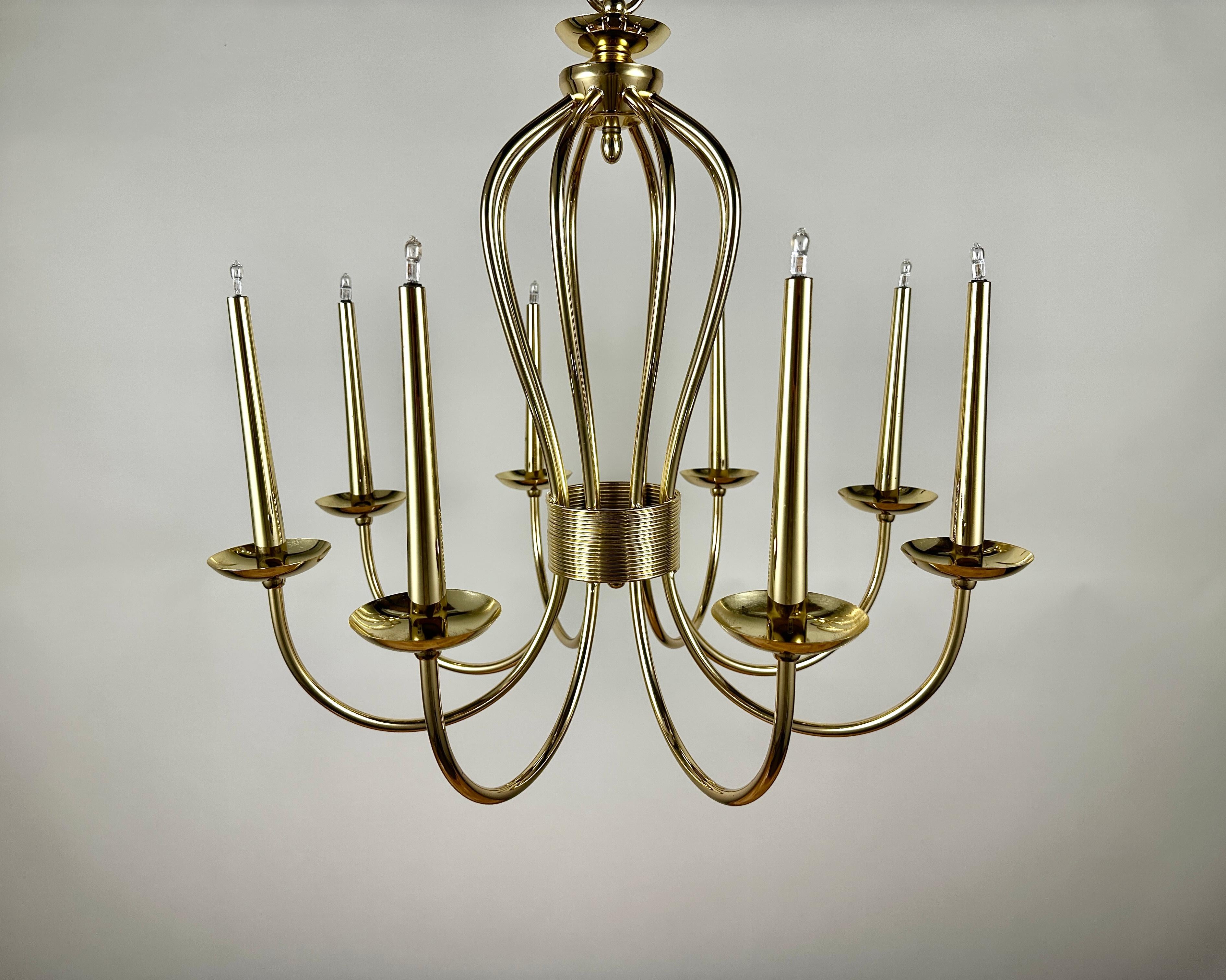 Stunning vintage chandelier, a true piece of German design history from the renowned manufacturer Sische Leuchten, dated September 1984.

This exquisite fixture boasts a beautiful gold plating over metal, creating a luxurious and warm aesthetic that