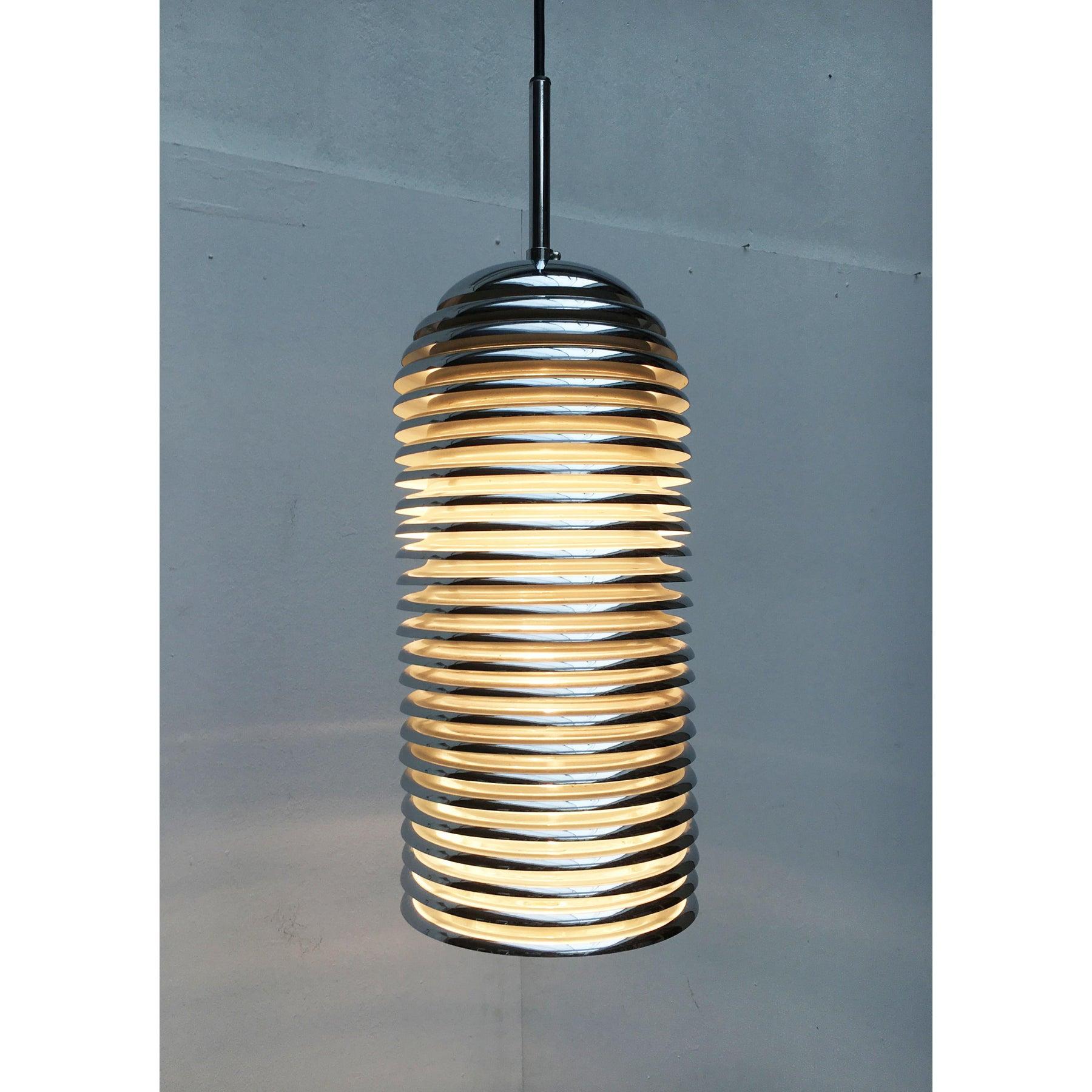 Saturno pendant lamp from Staff based on a design by Japanese designer Kazuo Motozawa from the 70s. Here in the narrow version.

The most striking element of the Saturno series are the slats that form the complete body of the lamp. These direct the