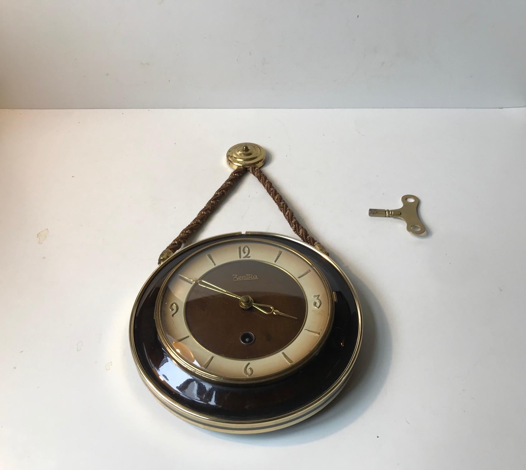 A Bauhaus styled wall clock with Manuel movement operated by key (included). Manufactured and designed by Zentra in Germany during the 1950s.