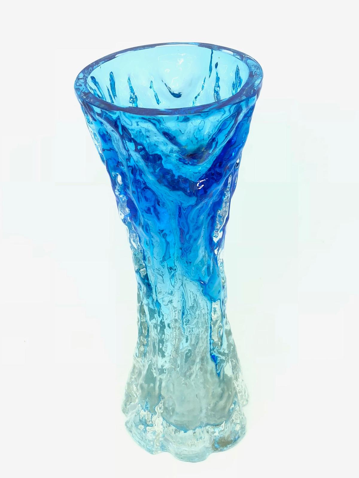 Wonderful Mid-Century Modern German vase by Ingrid Glas, circa 1970. This beautiful bright blue and clear vase brings a touch of fun and fantasy to any room with it's whimsical textured 'tree bark' form captured in vivid, vibrant blue coloured mouth