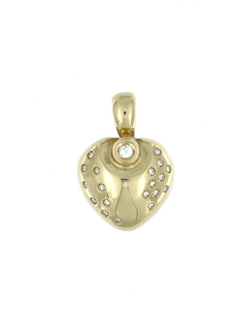 The Vintage German Yellow Gold Heart Pendant with Diamonds is a charming and timeless piece of jewelry that exudes a classic elegance. Crafted in Germany, this pendant showcases a beautiful heart-shaped design made from 14kt yellow gold, a popular