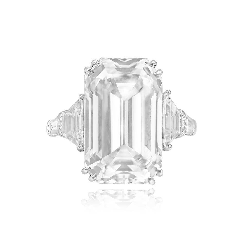 Magnificent diamond ring showcasing an antique GIA-certified 10.01-carat emerald-cut diamond, with exceptional D color and VS1 clarity. The shoulders are adorned with a combination of trapezoid, round brilliant cut, and baguette-cut diamonds, adding