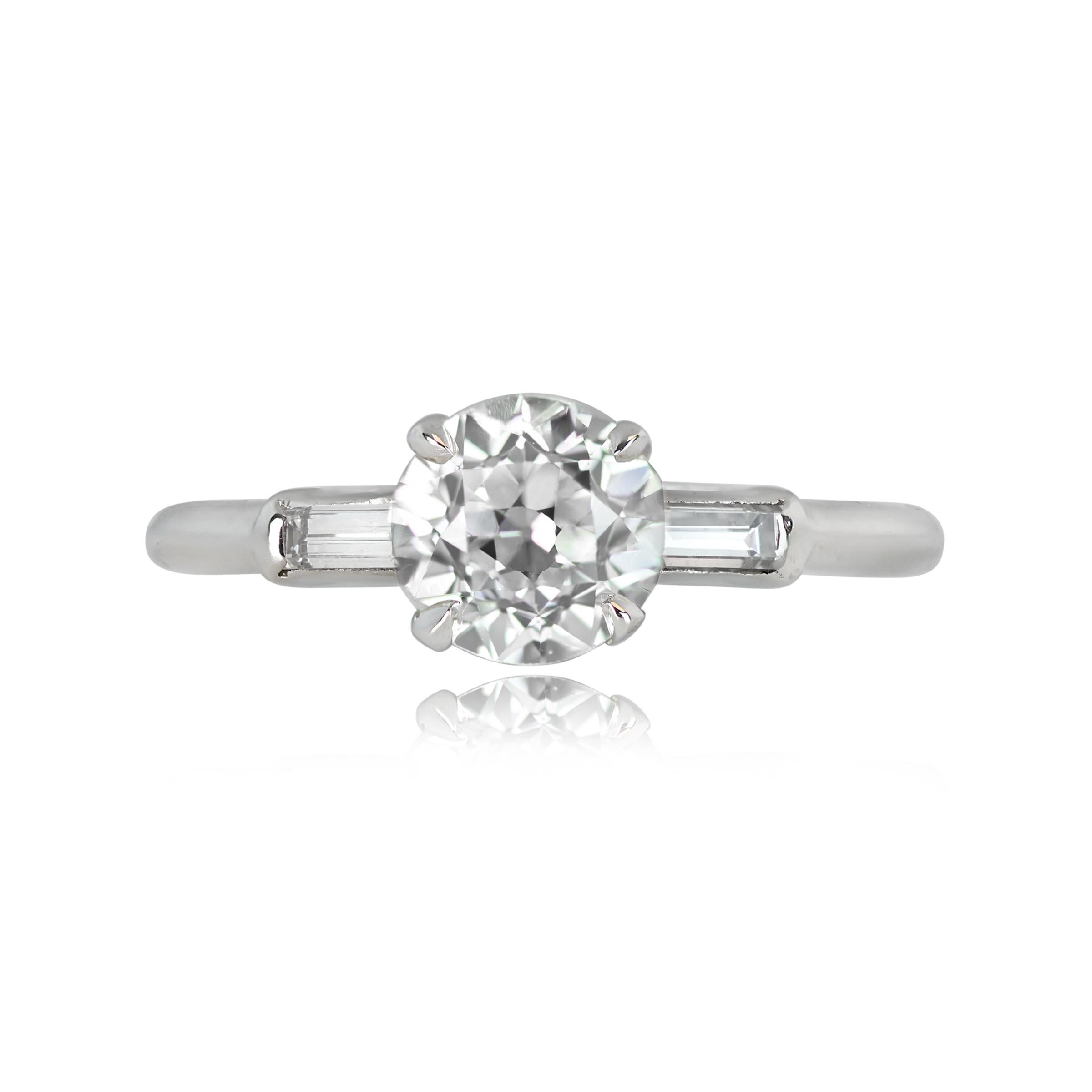 A vintage platinum ring boasts a GIA-certified 1.08-carat old European cut diamond, characterized by J color and VS2 clarity. The center stone takes its place securely set within prongs, while two elegant baguette-cut diamonds grace the shoulders,